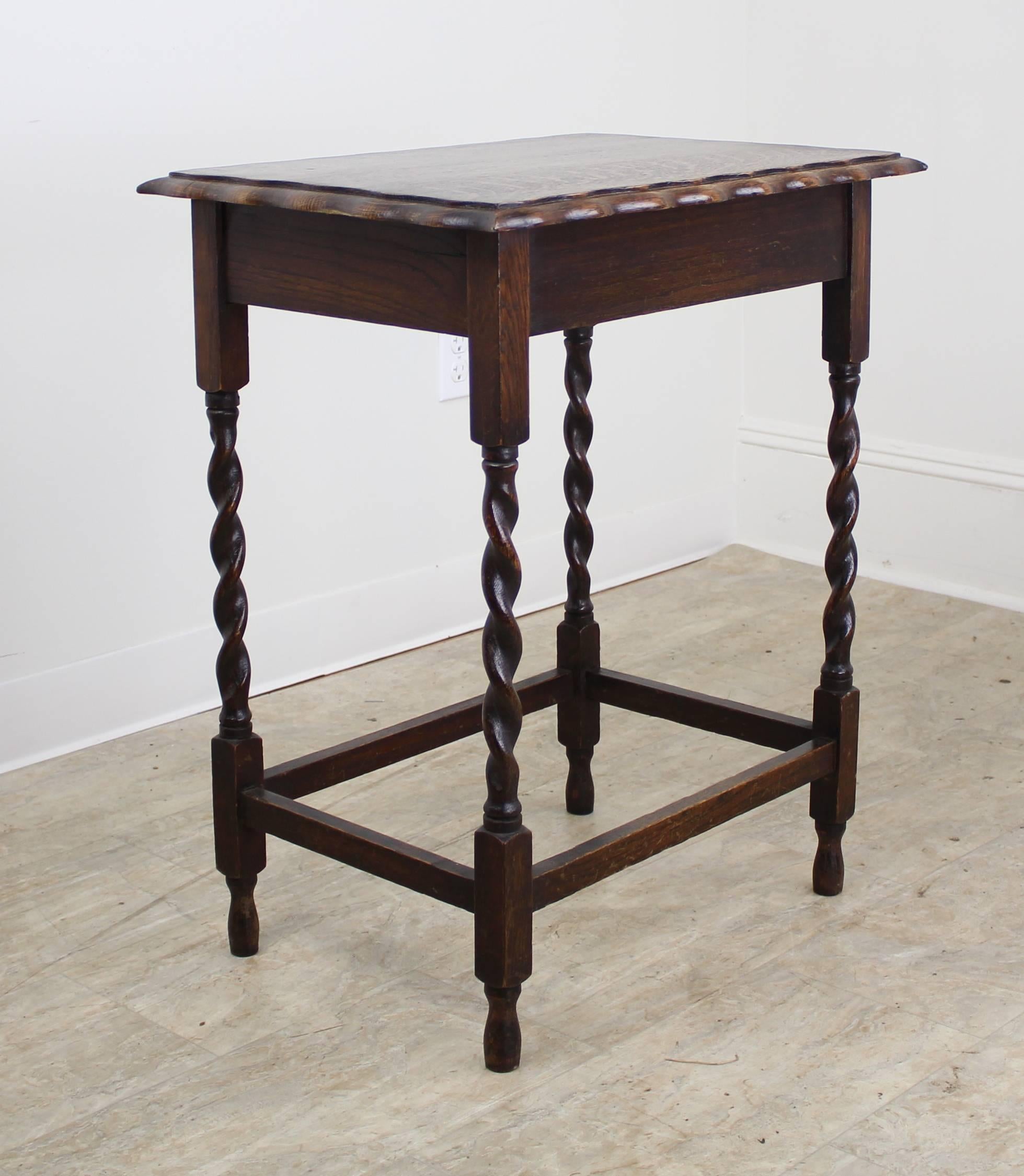 A charming simple occasional table in dark oak with eye-catching barley twists detail. Would make a nice lamp table and would pair nicely on either side of a sofa or guest bed with our other barley twist side table.