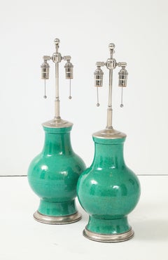 1940's Pair of Large Ceramic Lamps With A Stunning Emerald Green Glaze.