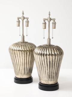 Pair of Large Fluted Metal Lamps with an Antiqued Silvered Finish.