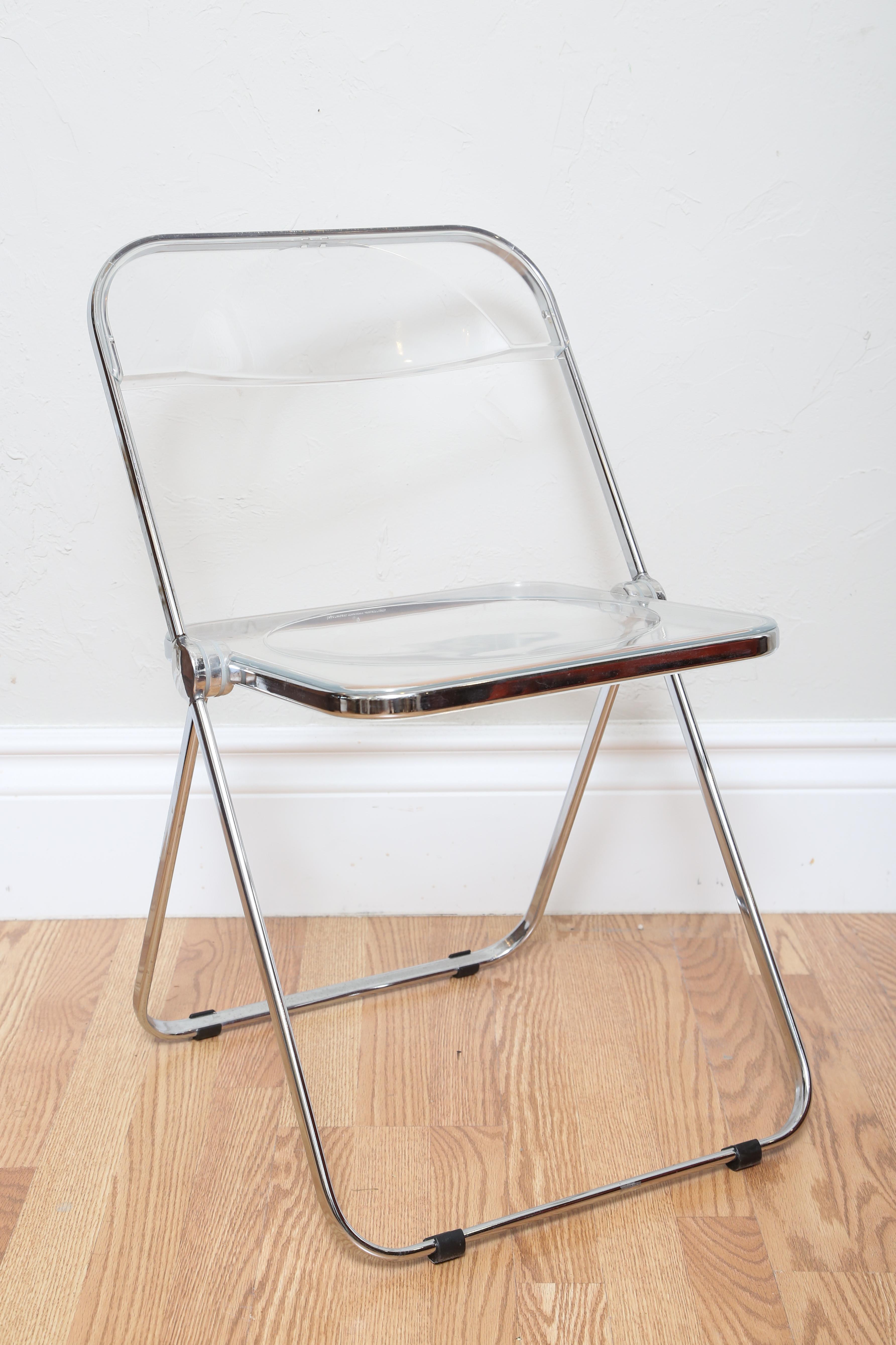 Set of four chrome and Lucite folding chairs made in Italy by Castelli.