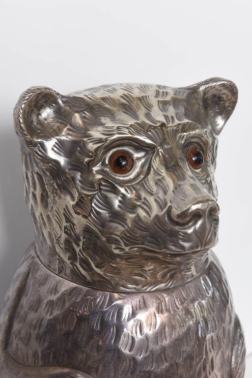Adorable silver plate teddy bear ice bucket with glass eyes.