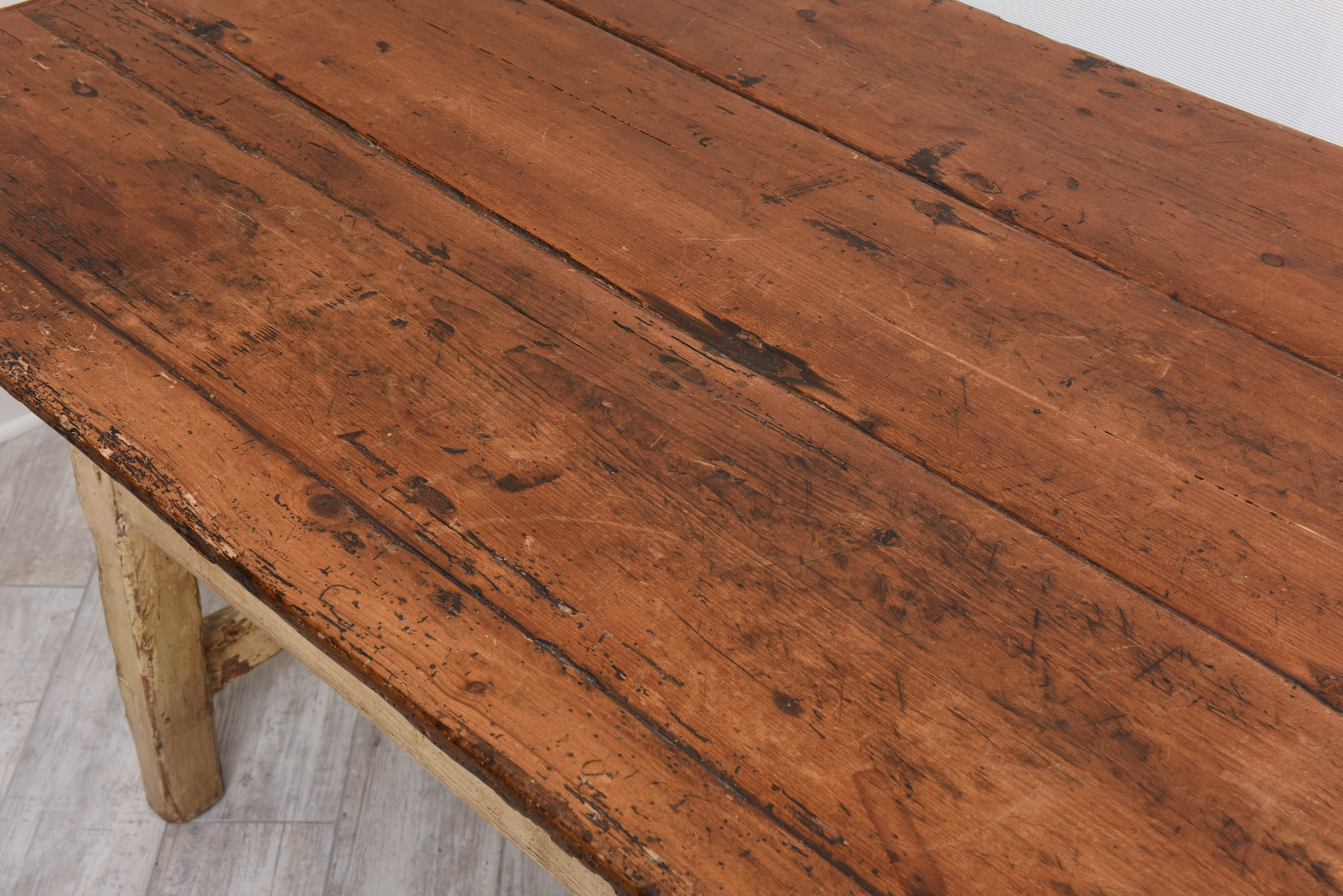 Antique 19th century Pennsylvania farm table with remnants of original paint. This versatile piece functions as both a table and bench.