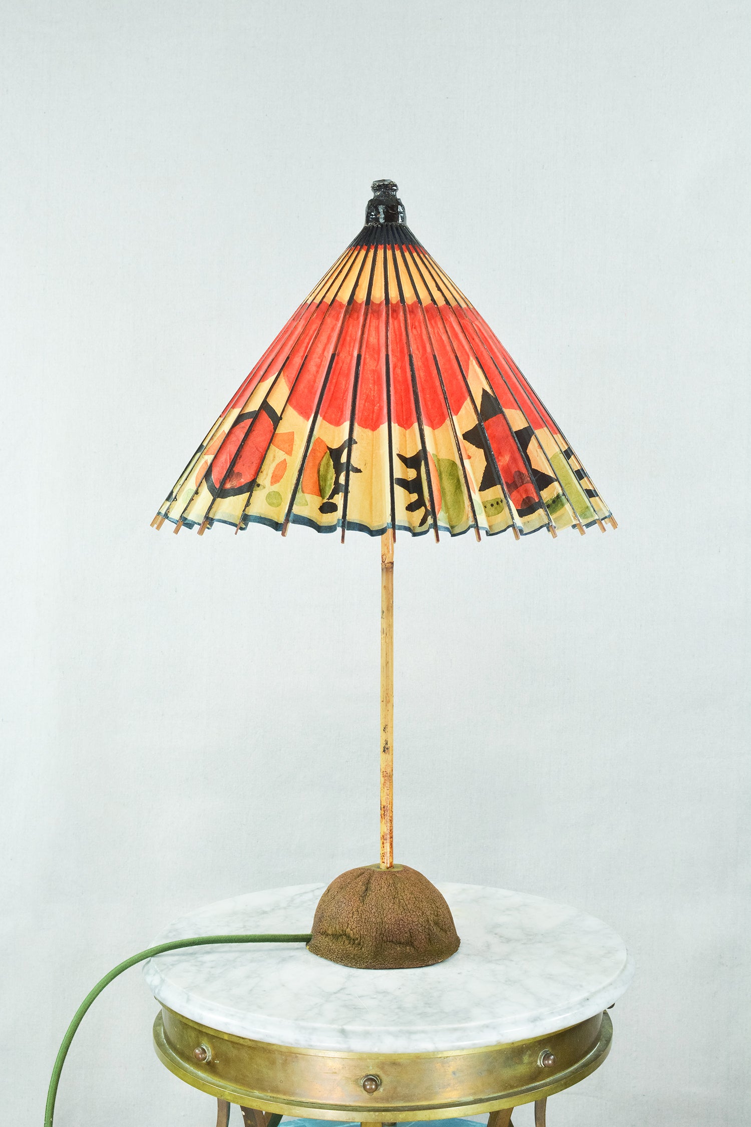 The One of One Collection is an ongoing series of single-edition floor and table lamps featuring shades made from particularly rare vintage paper parasols from our archive. 

Rest assured, you will never see another one like it.

Model No. 017 is a