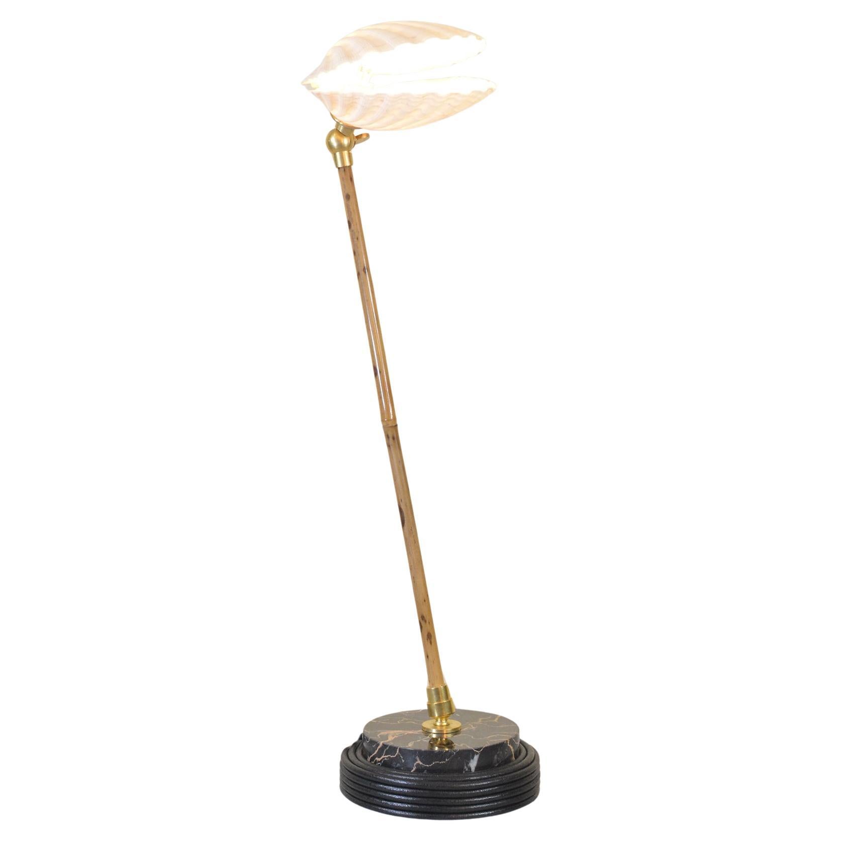 Introducing the Ligurian Summer Collection, a sophisticated family of handmade fixtures in natural sea shell, coiled leather, marble, and bamboo, inspired by the faded splendor of the northern Italian coast.

Model No. 27 features a graduated