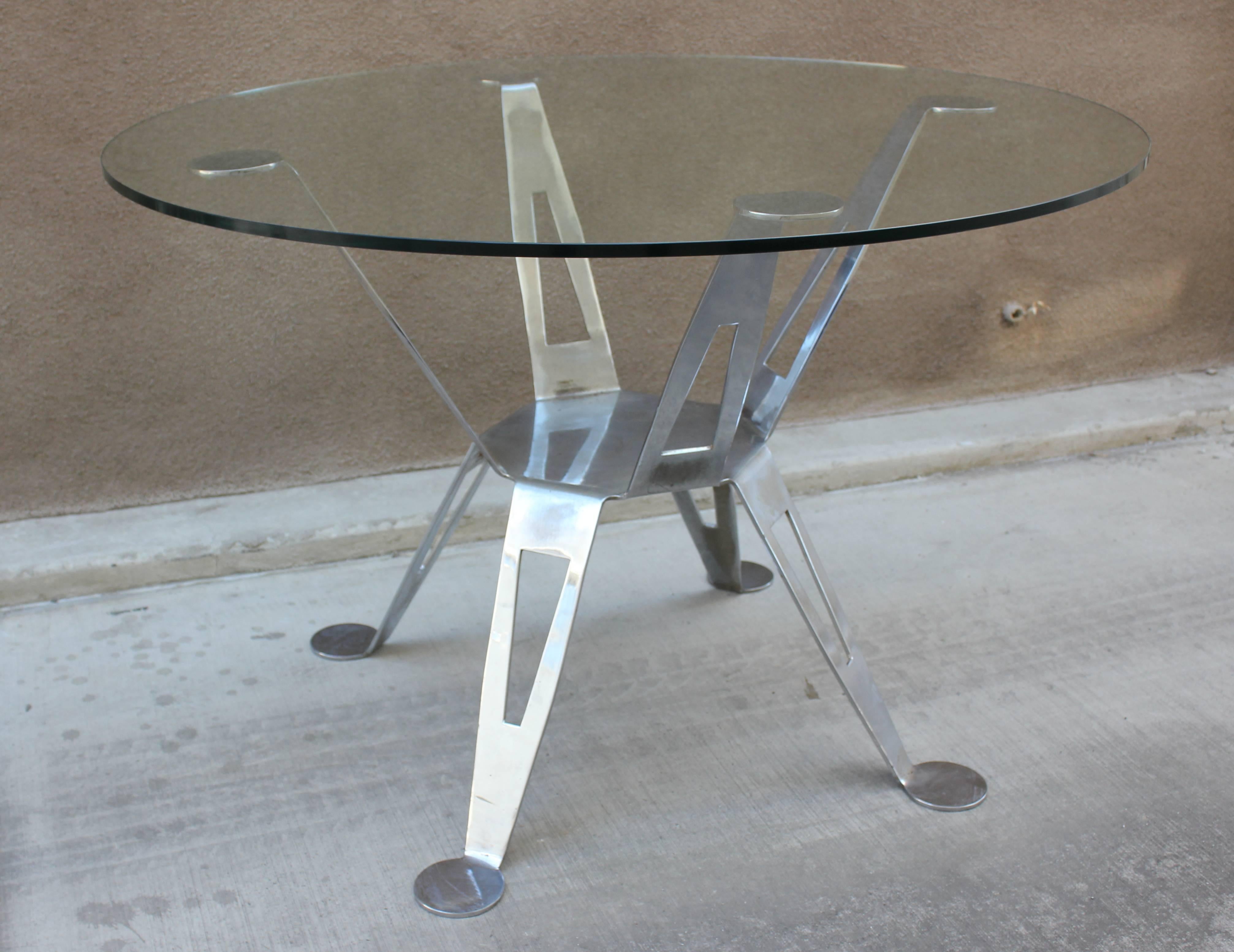 Extremely rare Pedro Ramirez Vazquez chromed steel dining table. Vazquez was a well known architect who worked in Mexico City. His furniture was custom or in limited editions. This table is cut from one piece of steel. Original finish with some