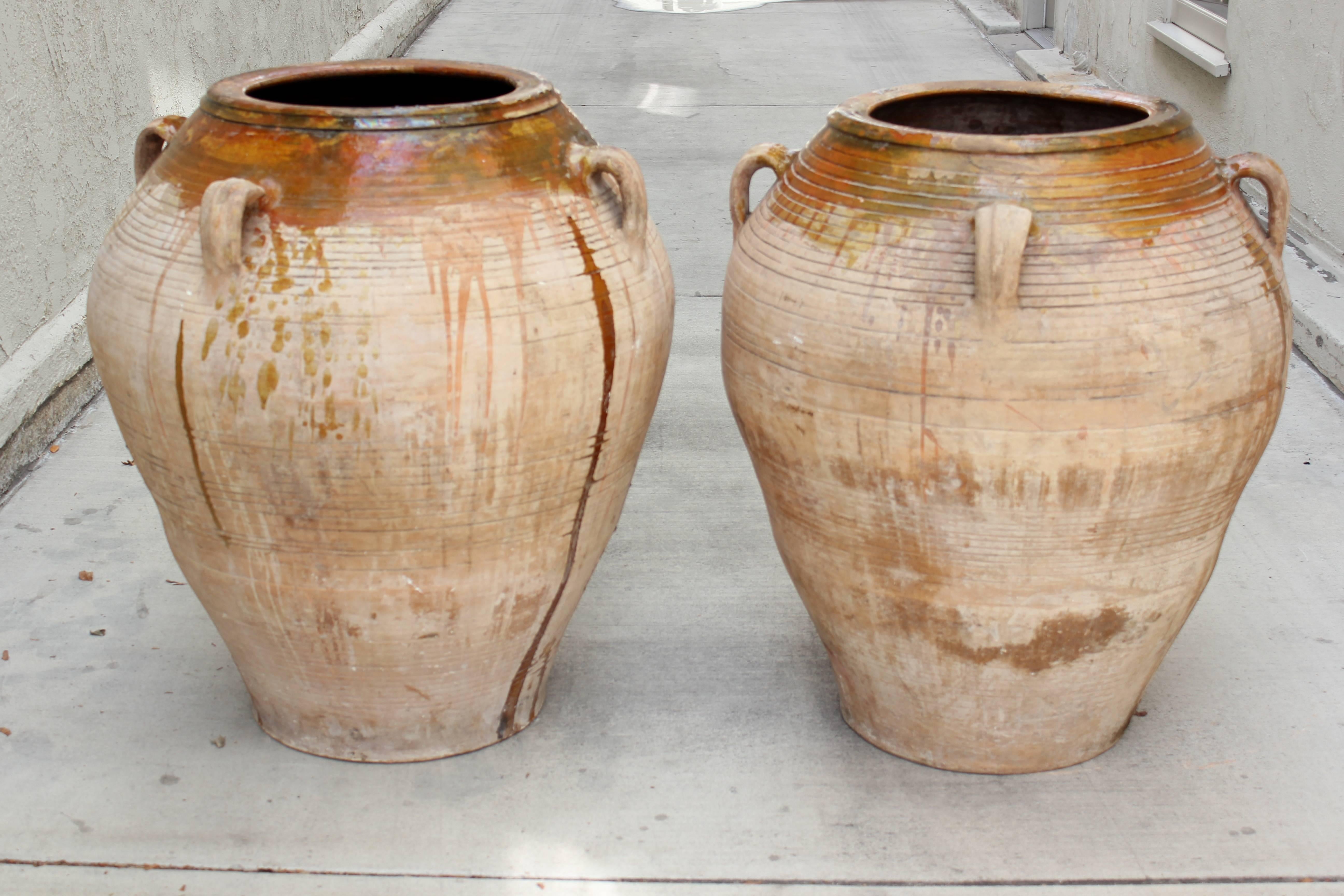 Pair of 19th century Spanish oil pots.
Measures: 3 ft. tall.