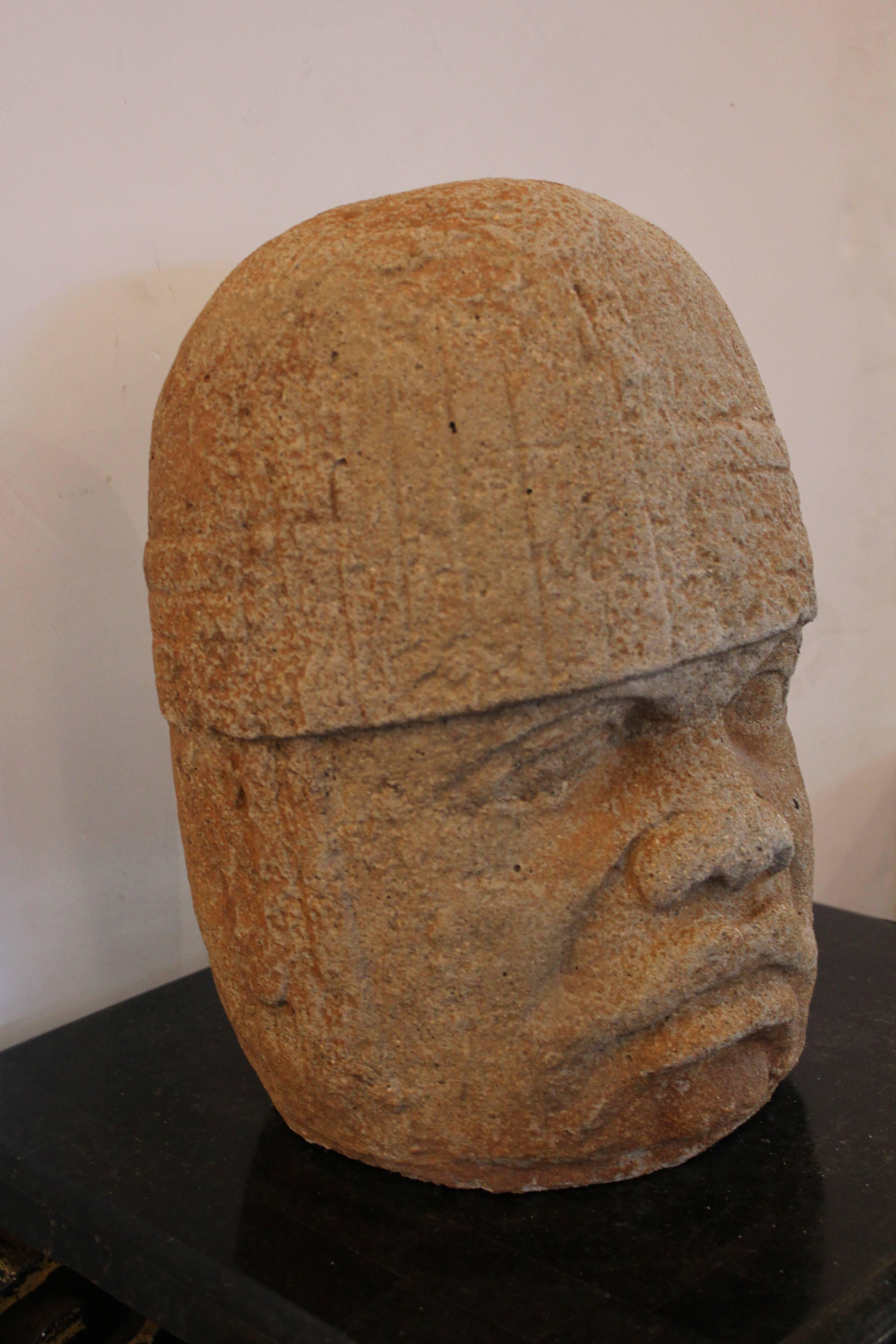 20th century cement Sculpture of an Olmec Head.  Previously used in an exterior environment . 