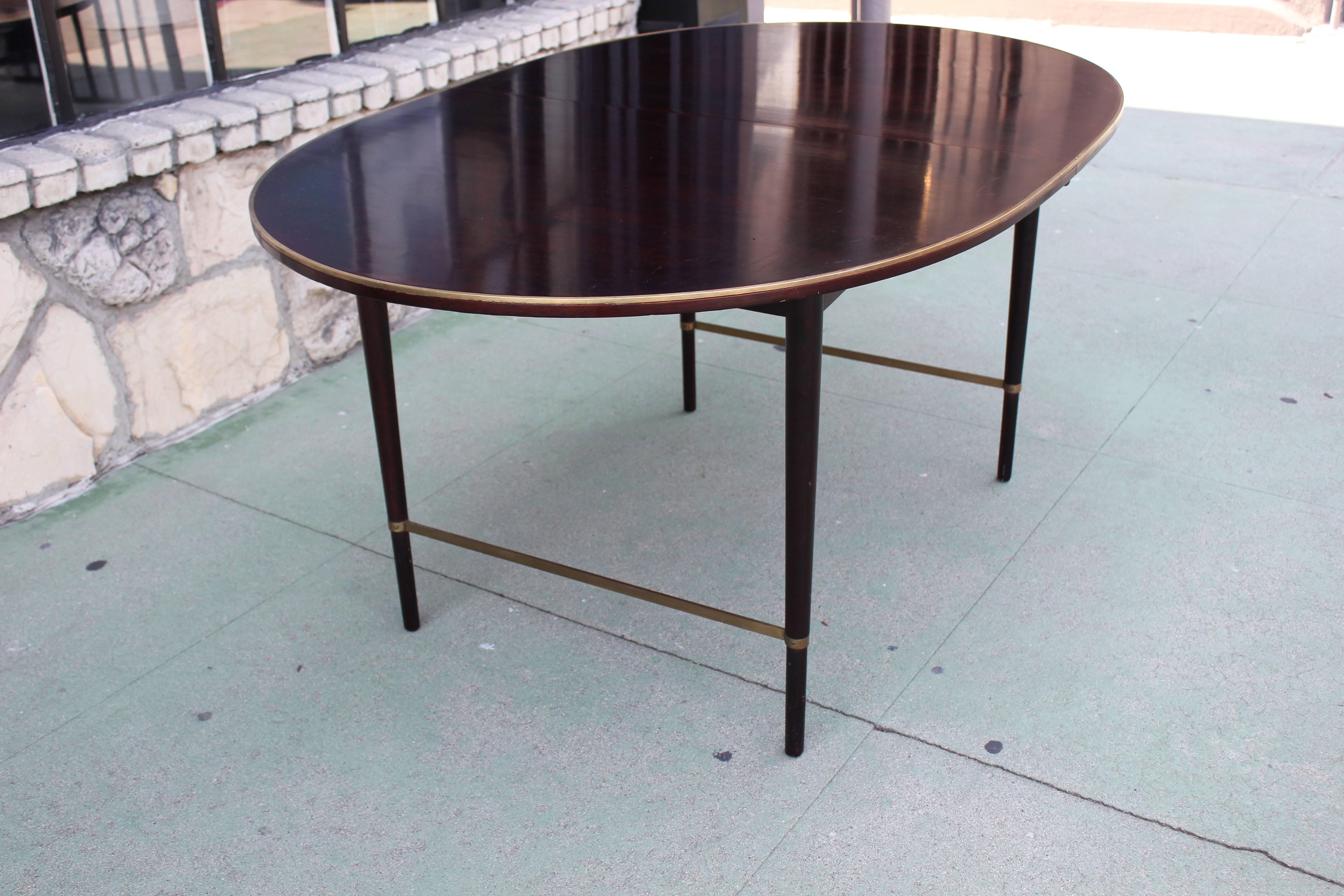 Brass and mahogany Paul McCobb dining table. Refinished. No leaves.