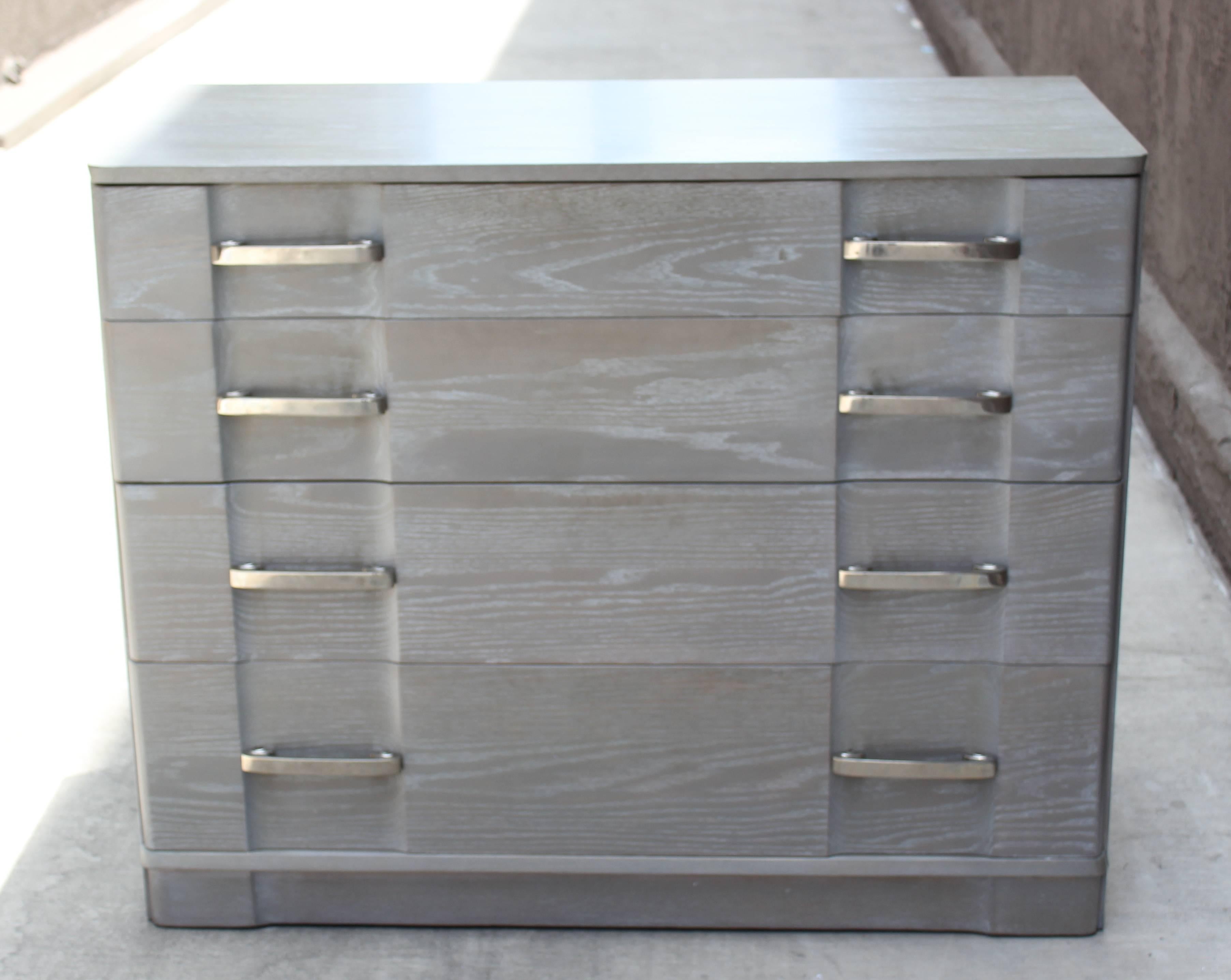 1940s gray cerused cabinet in the manner of Grosfeld House. Four graduated drawers.