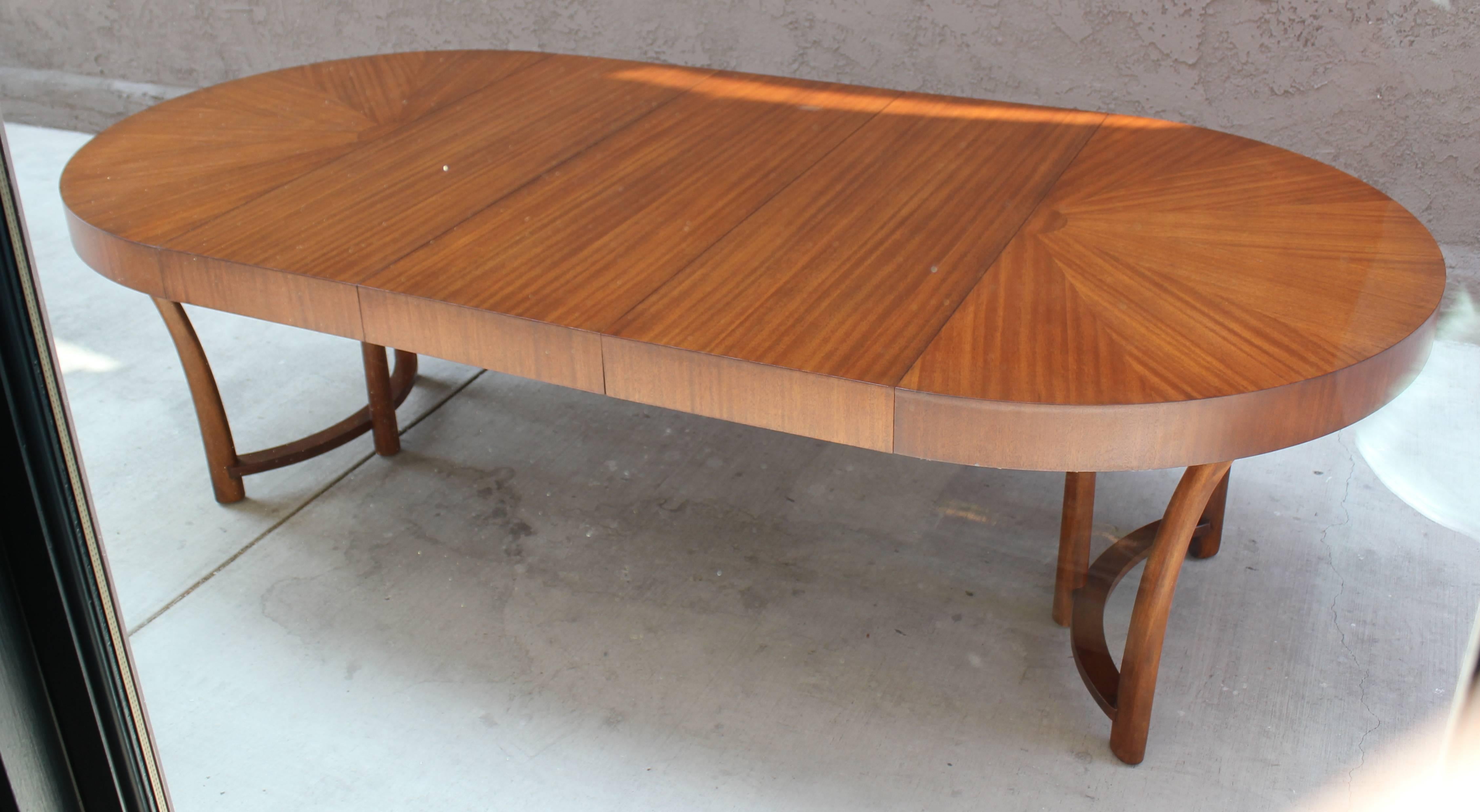 Style of Robsjohn-Gibbings dining table with mahogany sunburst tabletop. Designed for Widdicomb, late 1930s. Three leaves. Restored. 3 - 16
