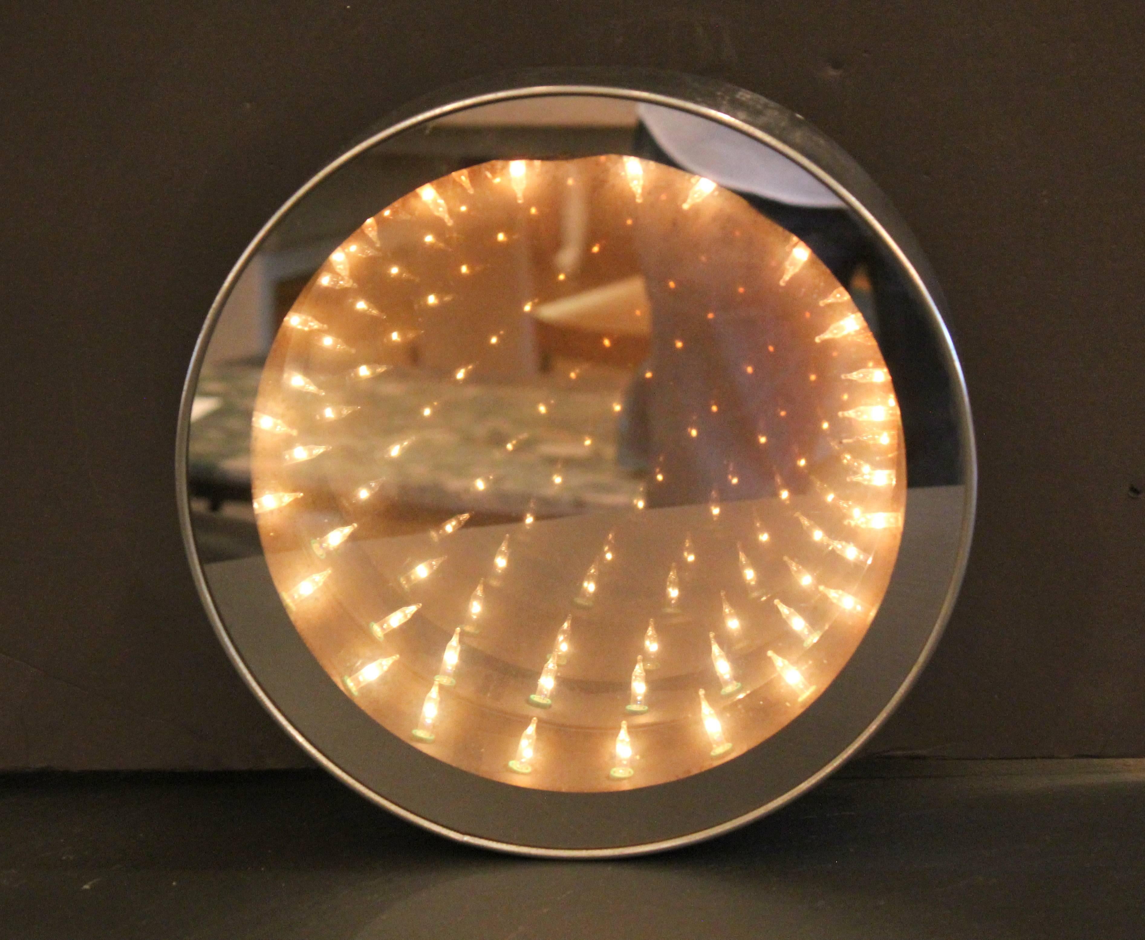 Chrome framed infinity mirror from the 1970s. Curtis Jere. Not marked. Lighted from within. Requires to plugged in.