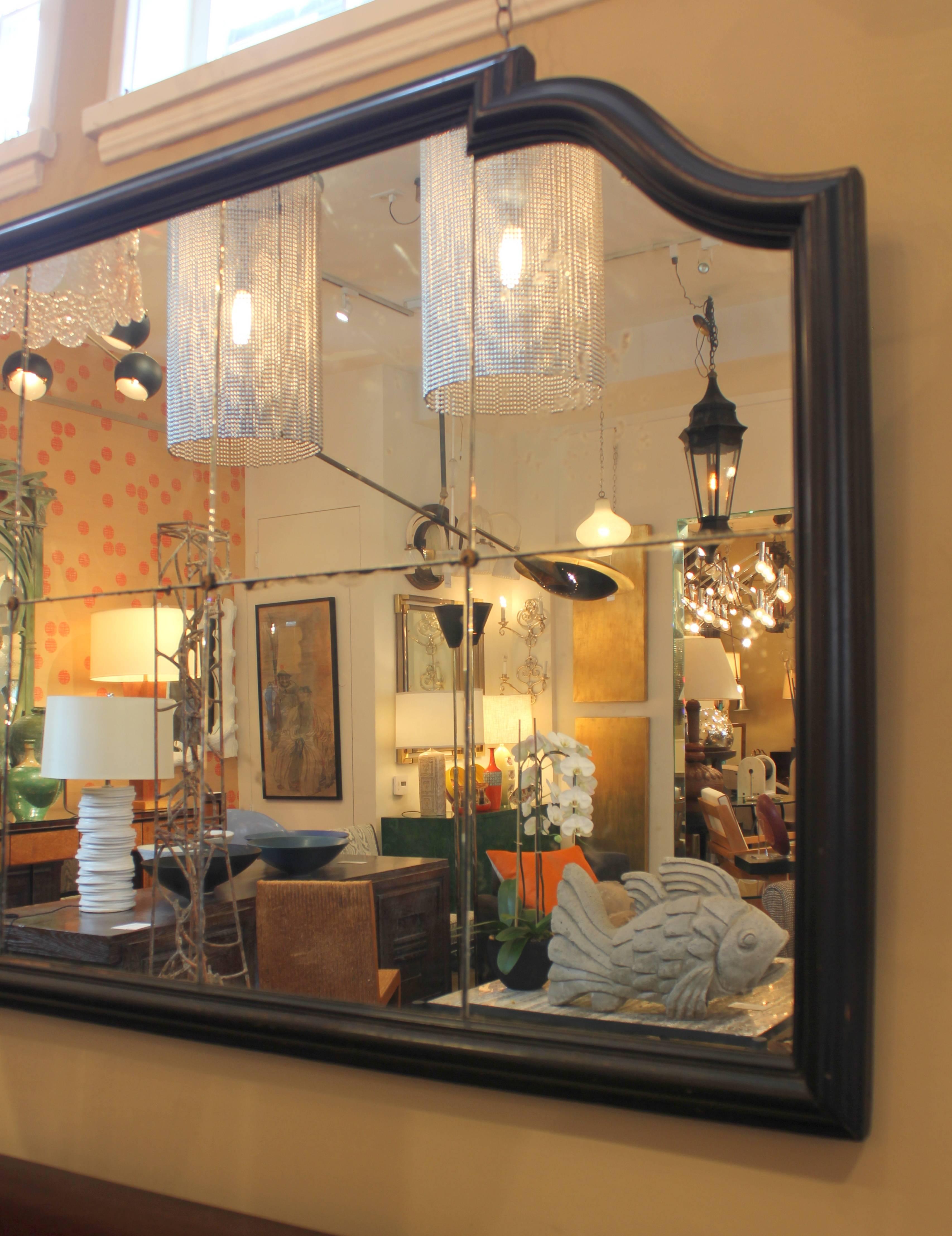 Paneled mirror with black frame and bronze rosettes. Beautiful patina to mirror. Frame original. Glass original.