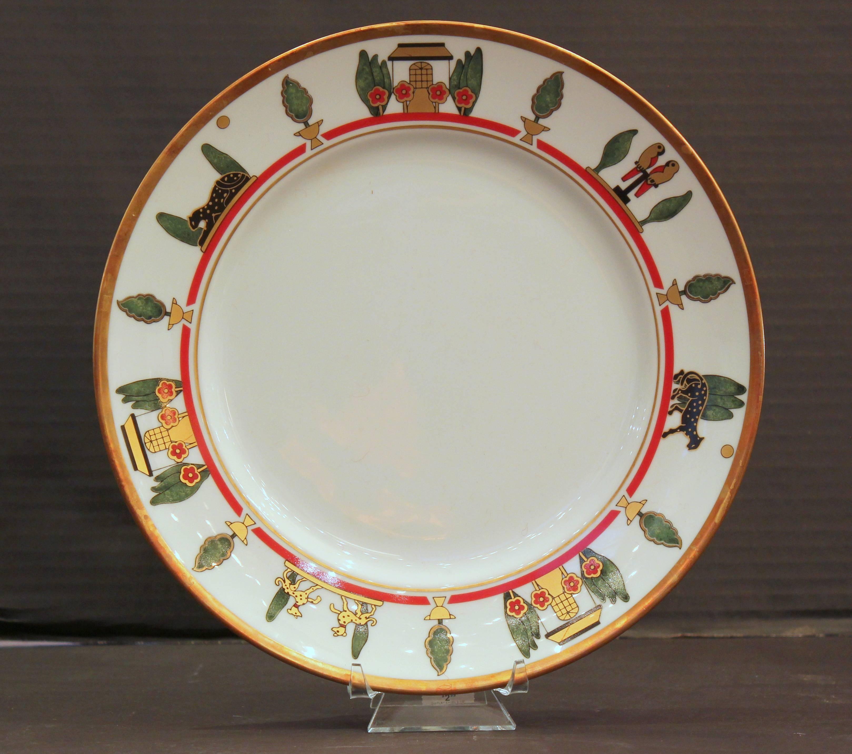 La Maison De Louis Cartier six place setting that includes:
Dinner plate.
Salad plate
Bread and butter plate
Cup and saucer.
Gold rim.
Made in France by Limoges.