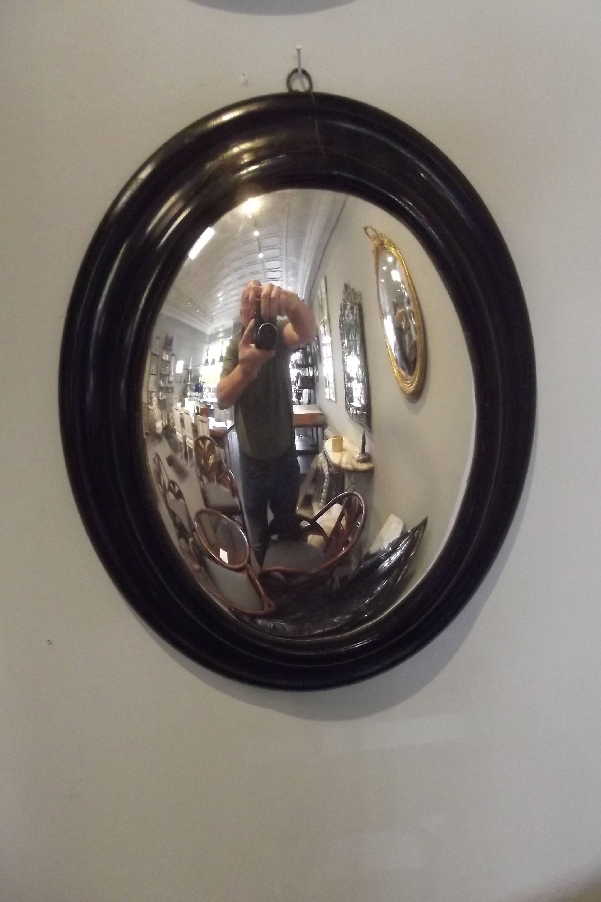 A grouping of four Napoleon III convex mirrors.  Dimensions below are for the upper left mirror, the dimensions of the upper right mirror are 17.5