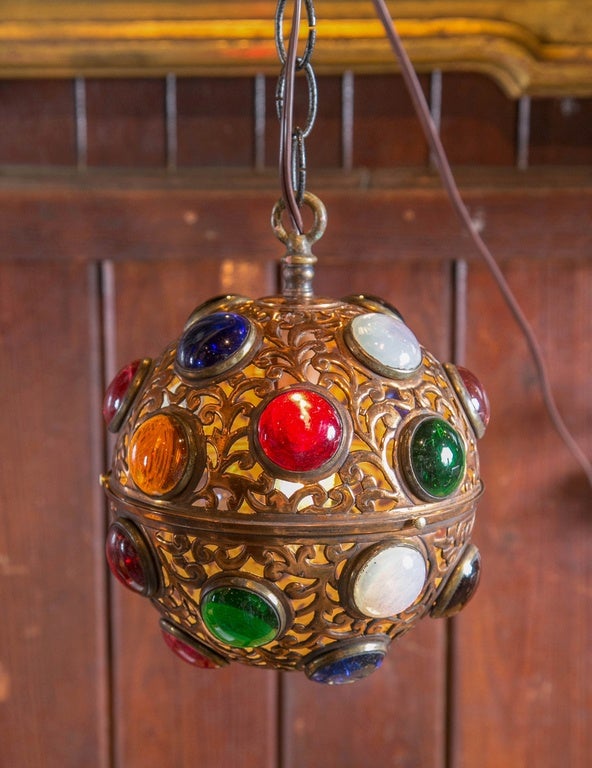 Glass jewel encrusted metal globe light. One chandelier bulb.