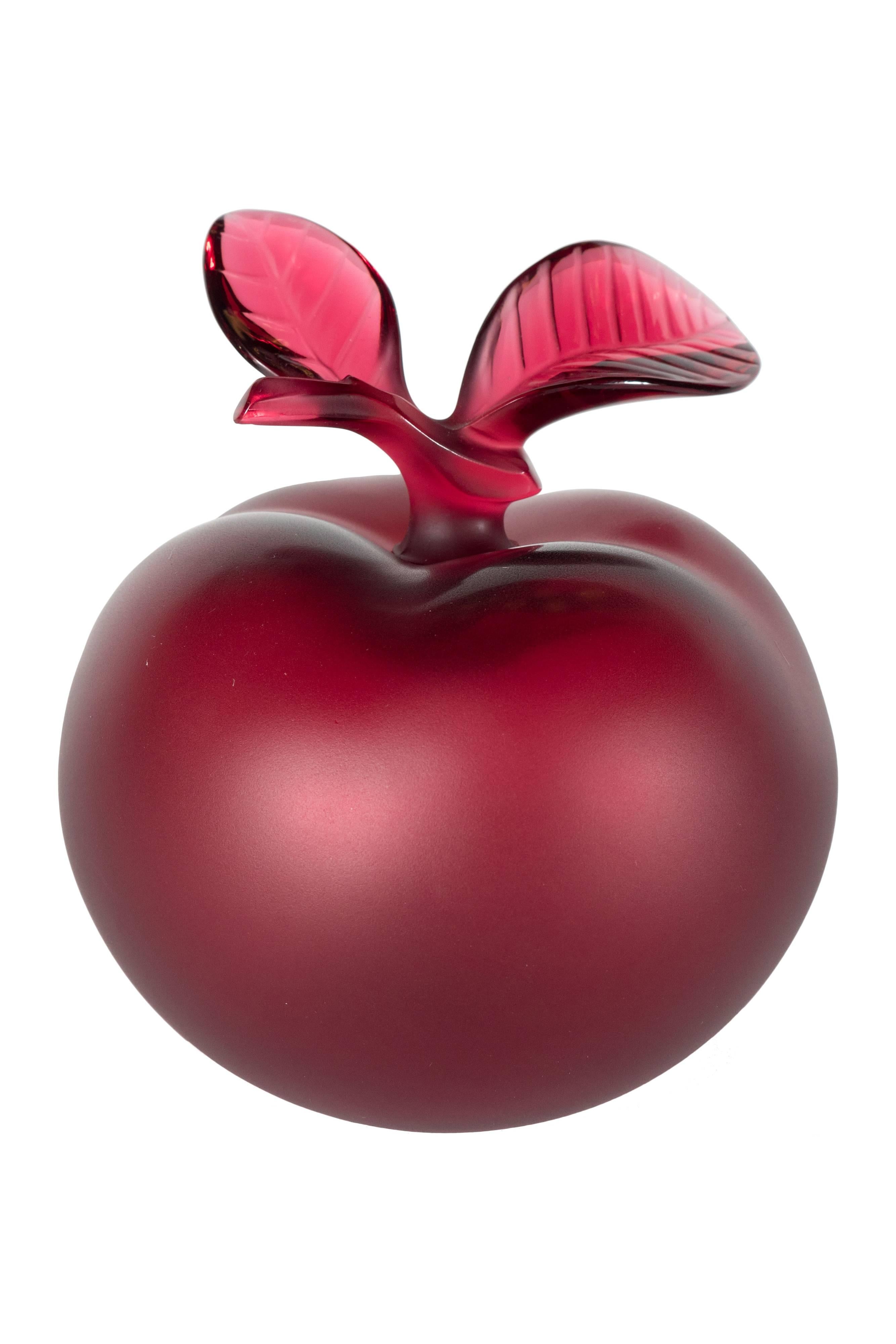 perfume in red apple shaped bottle