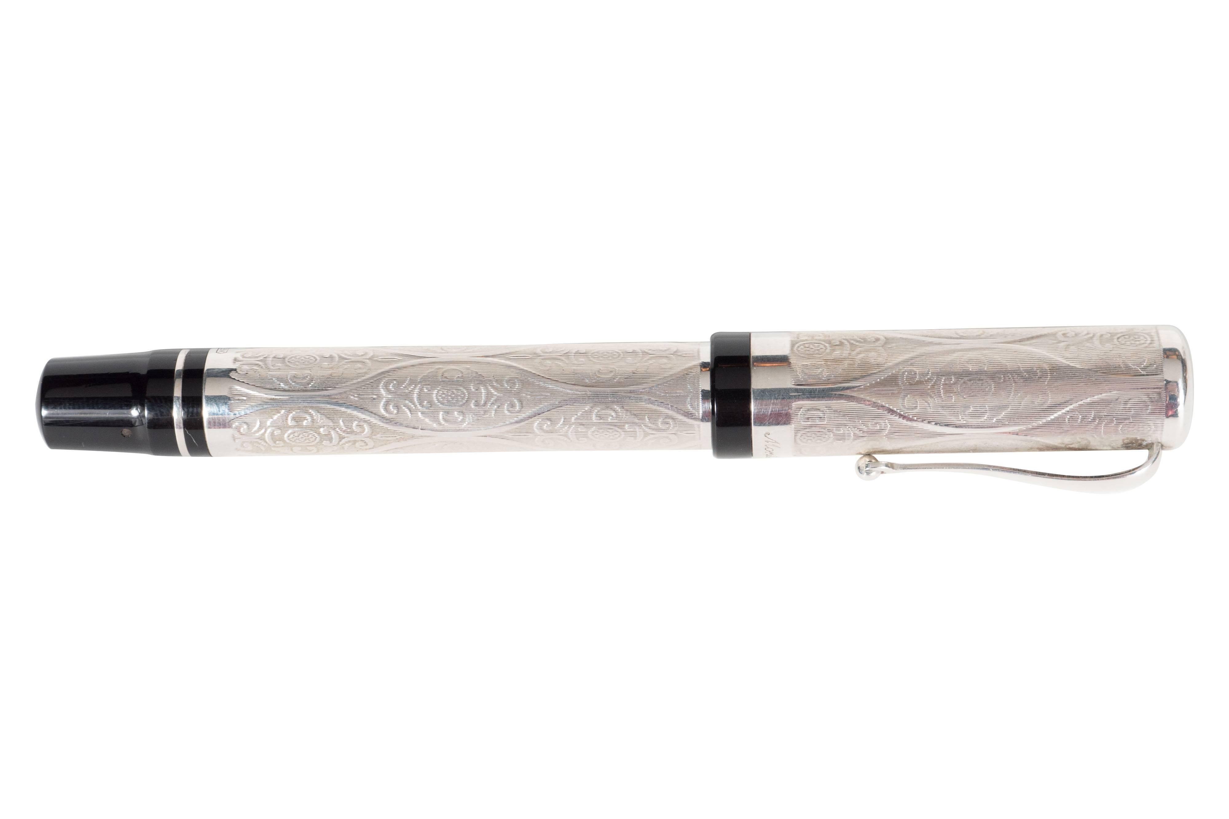 A Montegrappa limited edition Cosmopolitan Baroque sterling silver fountain pen. Intricate etched Baroque-style detailing adorns the pen and removable cap. This was a limited edition of 500 ever produced. Cap piece is signed 