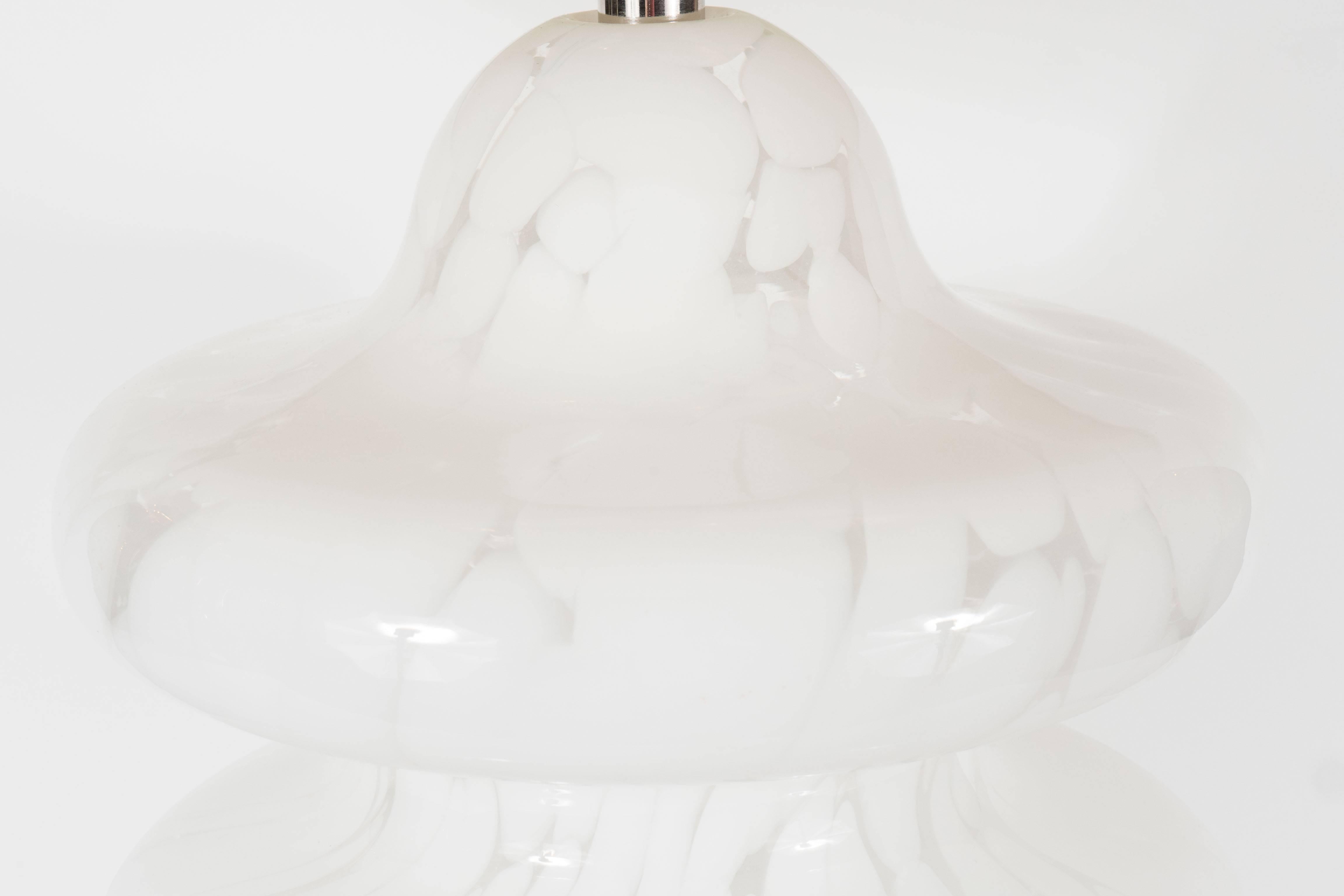 A Mid-Century Modernist table lamp in frosted and satin Murano glass with polished chrome base by Vistosi. Flowing curves of mottled glass give this piece an airy disposition with a TOTEM like form. A chrome base supports the sculptural piece. It