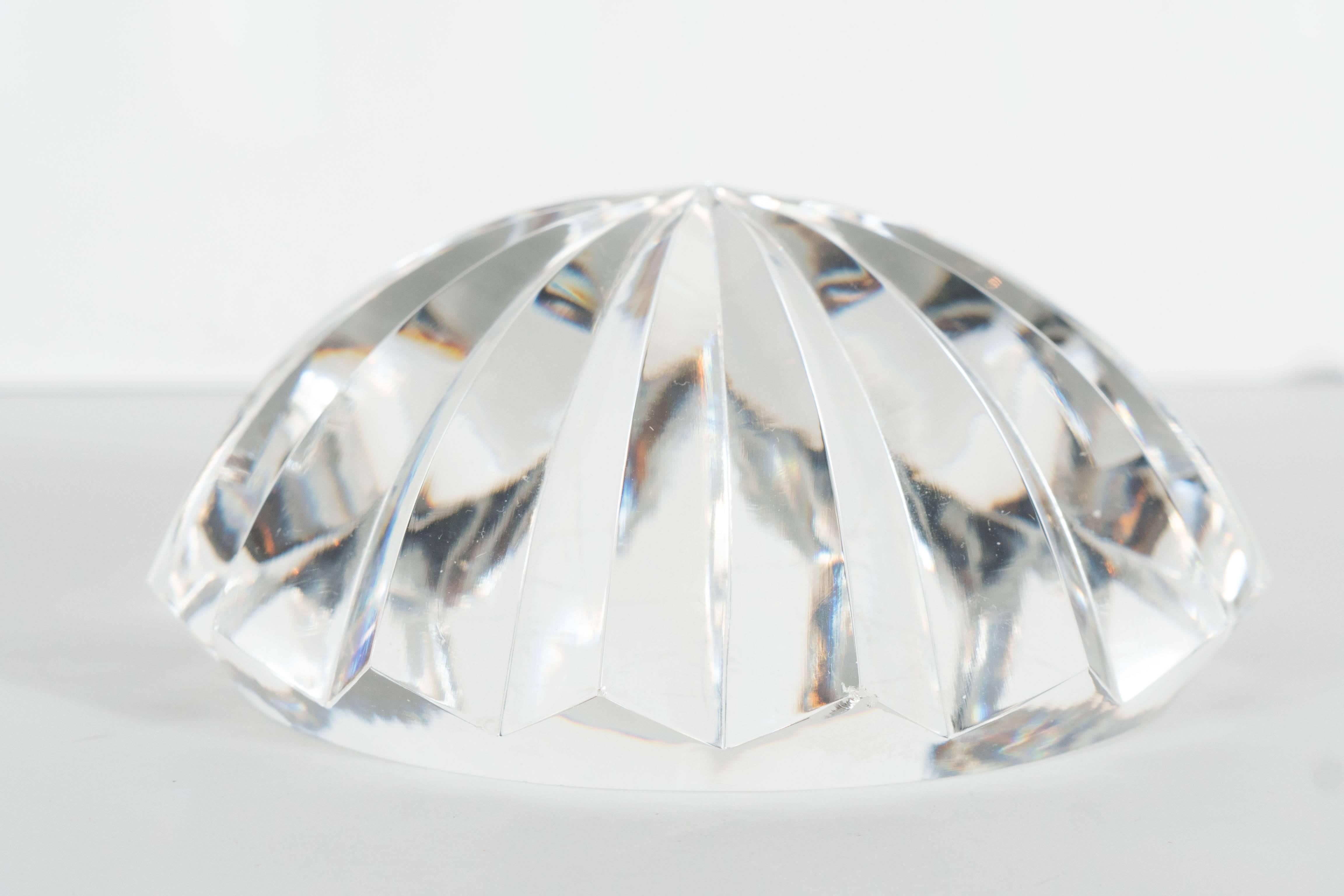 This beautiful faceted crystal paperweight by Baccarat features 16 segments of cut crystal in radial symmetry. It would make lovely addition to any console or desk as a decorative object, not to mention as a functional paperweight. The Baccarat seal