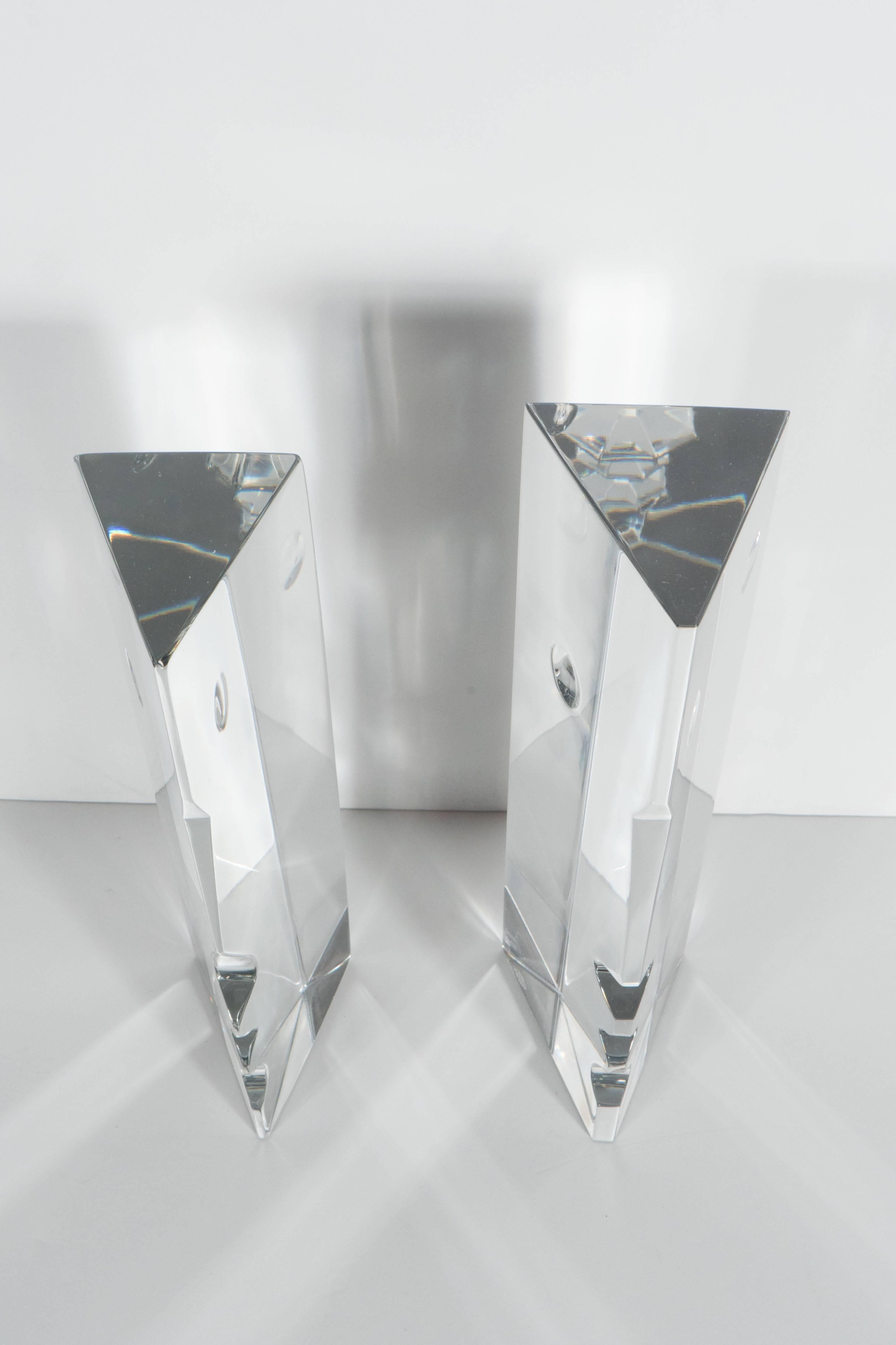 These pair of Mid-Century Baccarat R. Rigot crystal face bookends features a stylized face of a man and a woman in profile in a Cubist manner. They are signed by the artist R Rigot and also bear the acid etched Baccarat seal on the bottom. They are