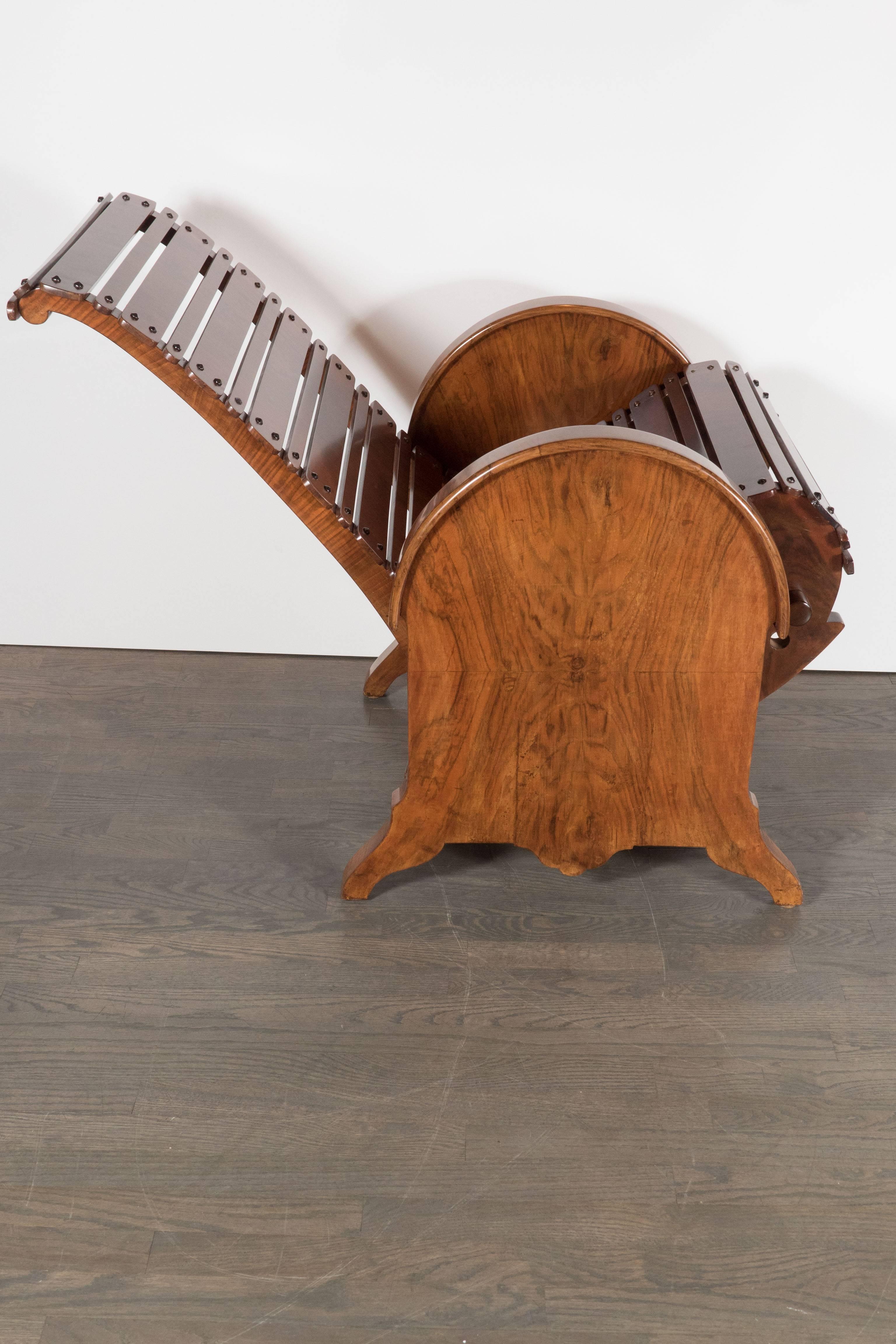 A French Art Deco bookmatched burled walnut adjustable chair with slatted design. The adjustable mechanism allows the chair to tilt back smoothly. Interchanging wide and narrow solid walnut horizontal slats with antique brass studs make up the seat.