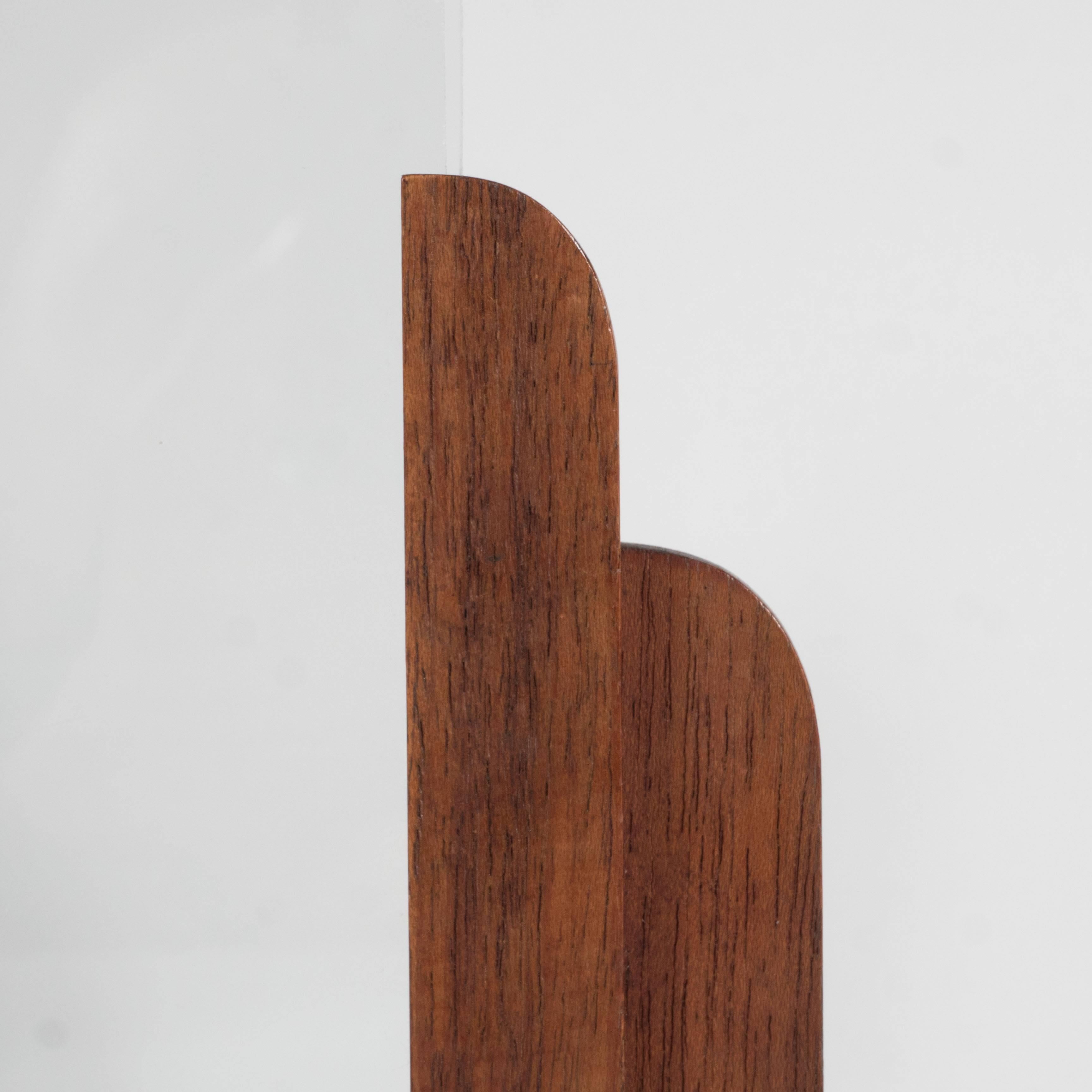 This Art Deco frame features a two tiered streamline arch design in fine mahogany. It supports a glass picture frame that can hold a photo size 3.25 by 6. Excellent condition.