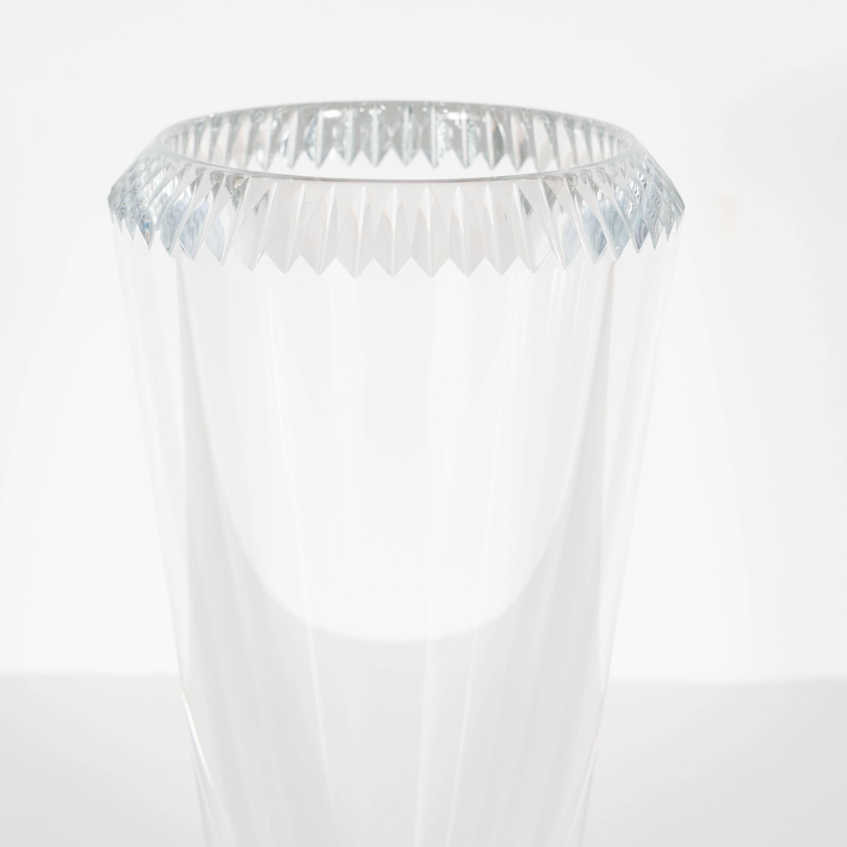 This gorgeous vase features a clean modern design with a border on top of diamond cut detailing in a great geometric pattern. This piece is a great accent as well as functional piece which will add a touch of sparkle to any decor. This bears the