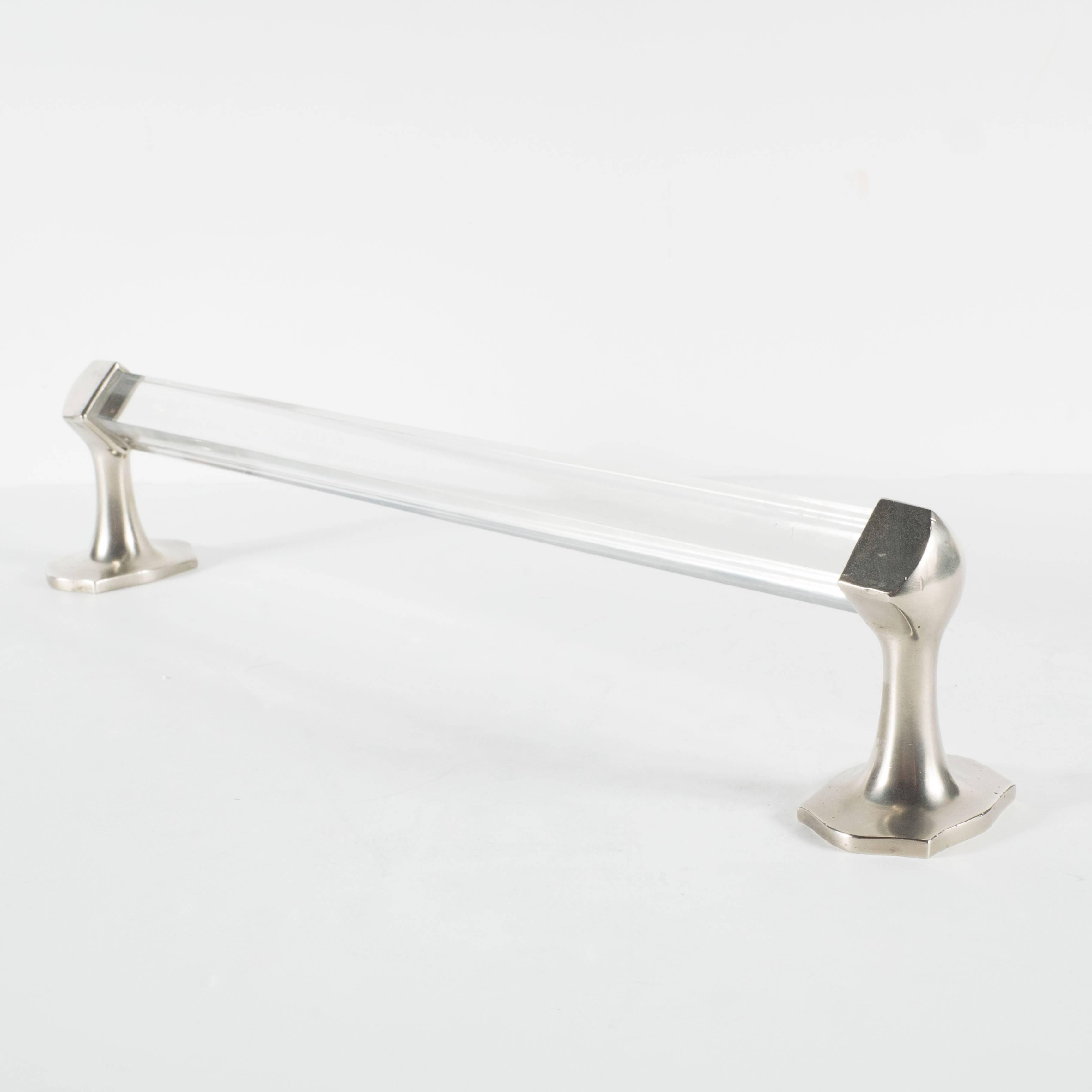 A superb pair of Mid-Century Modern Lucite and brushed nickel towel rods, beautifully designed with transparent angular shaped Lucite rods attractively finished at each end with nickel angular shaped wall fixtures. The Lucite is in very good