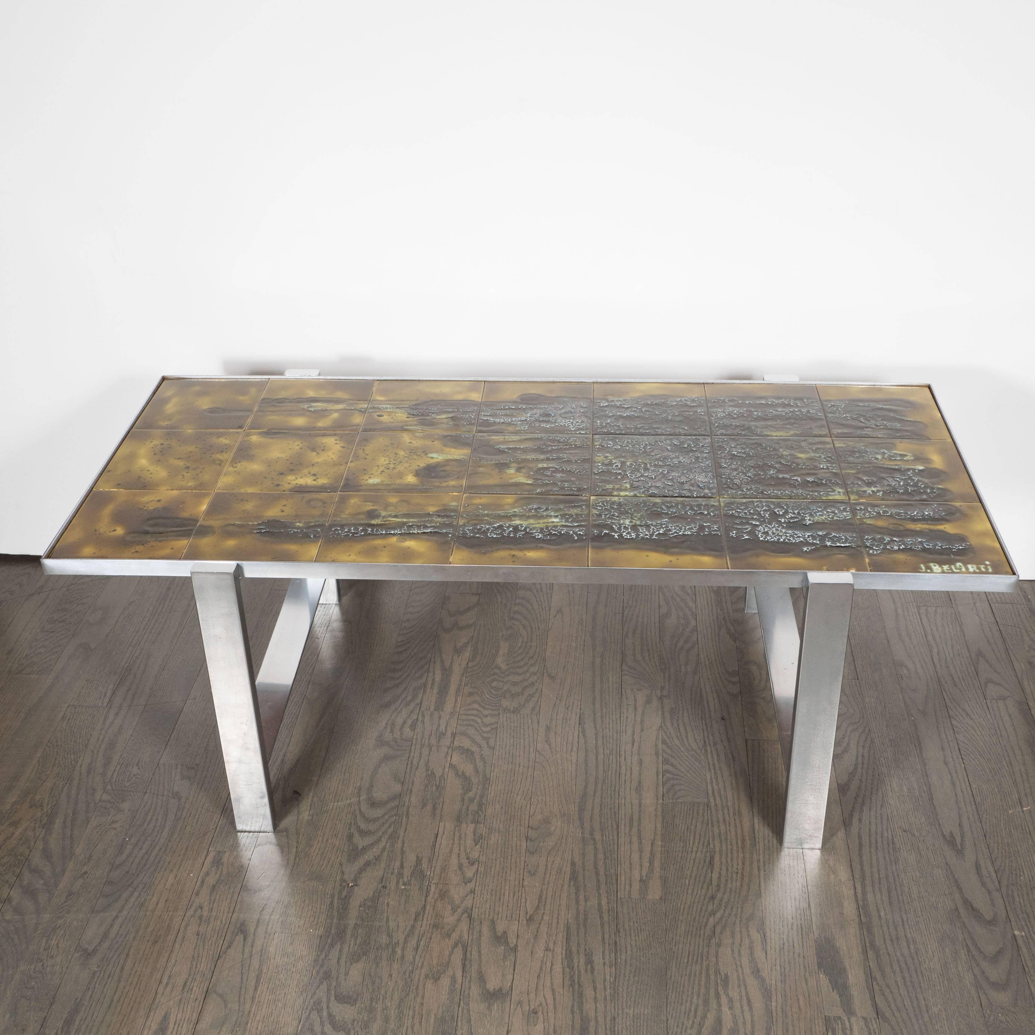 A stunning Mid-Century Modern ceramic tile and polished aluminium coffee table by Juliette Belarti, the tabletop with dark mossy green black brown handcrafted ceramic tiles signed 