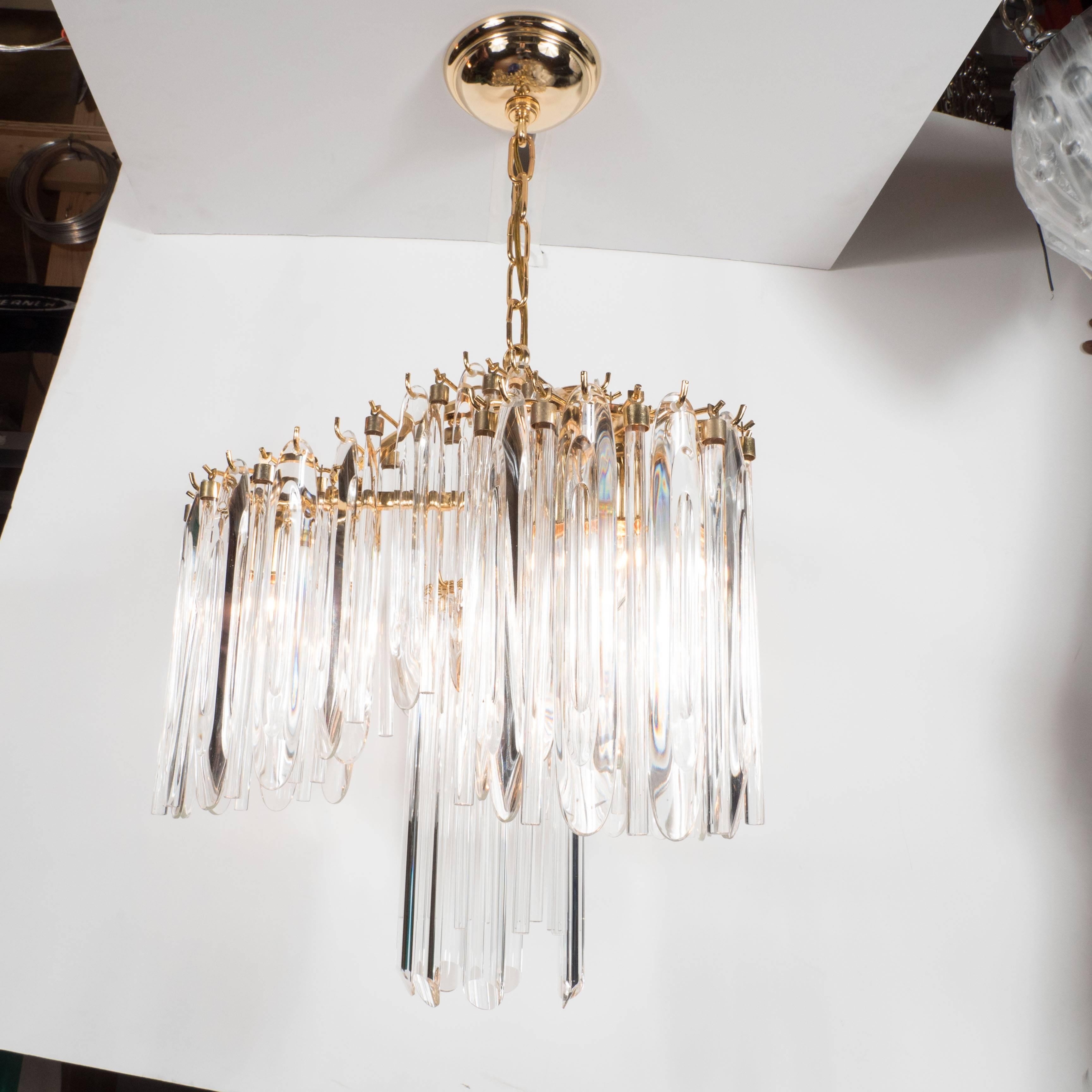 This stunning Mid-Century Modern chandelier was realized by the fabled Austrian maker, Lobmeyr, circa 1970. It features a two tier draped pagoda design created by an abundance of elegant, elongated and featherlike crystals. The frame is composed