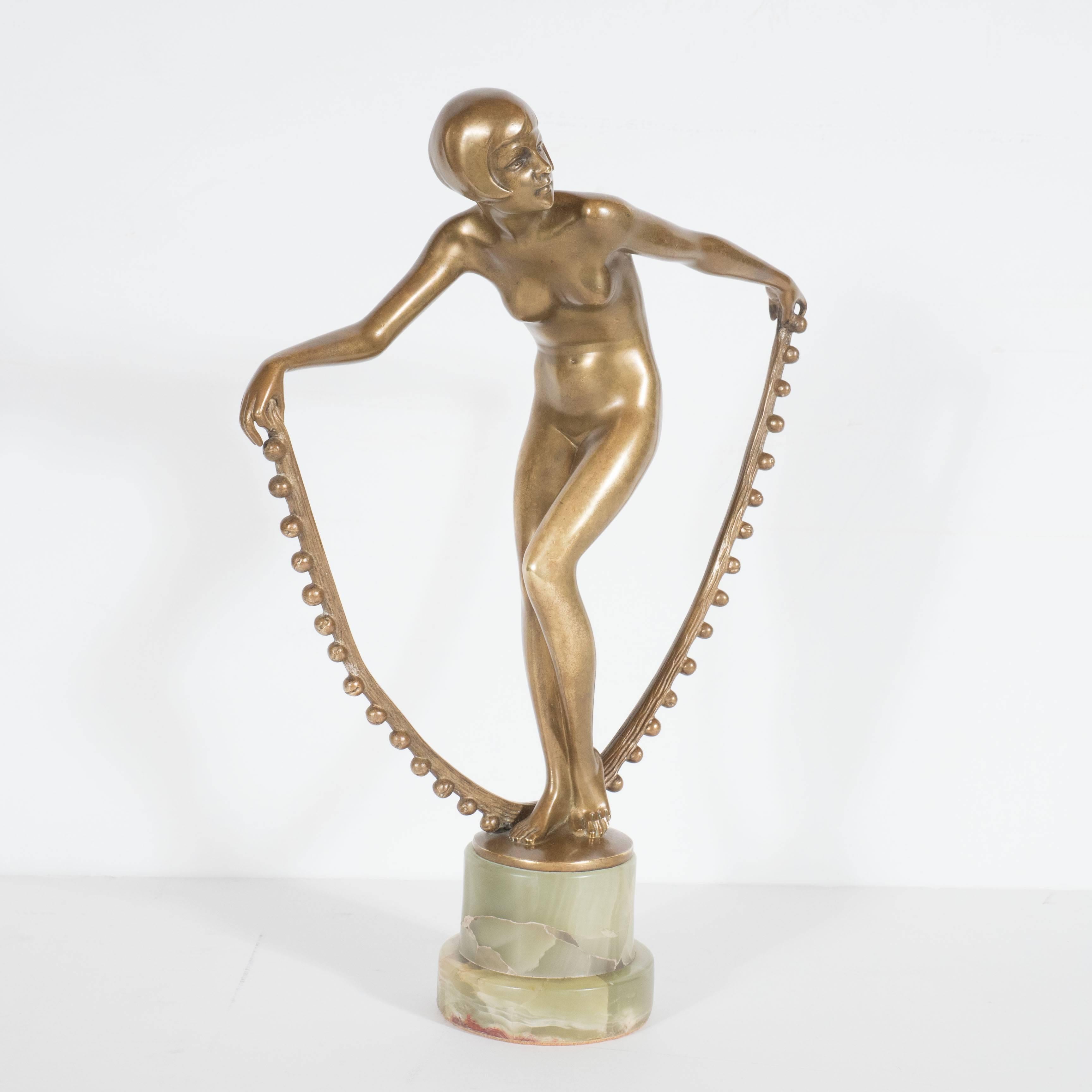 Deco Dancer by Josef Lorenzl gilt-bronze sculpture on onyx base, Austrian circa 1935, this stunning early 20th century deco dancer sculpture depicts a beautiful typical dancer from the fascinating 1920s and 1930s featuring the revolutionary boy hair