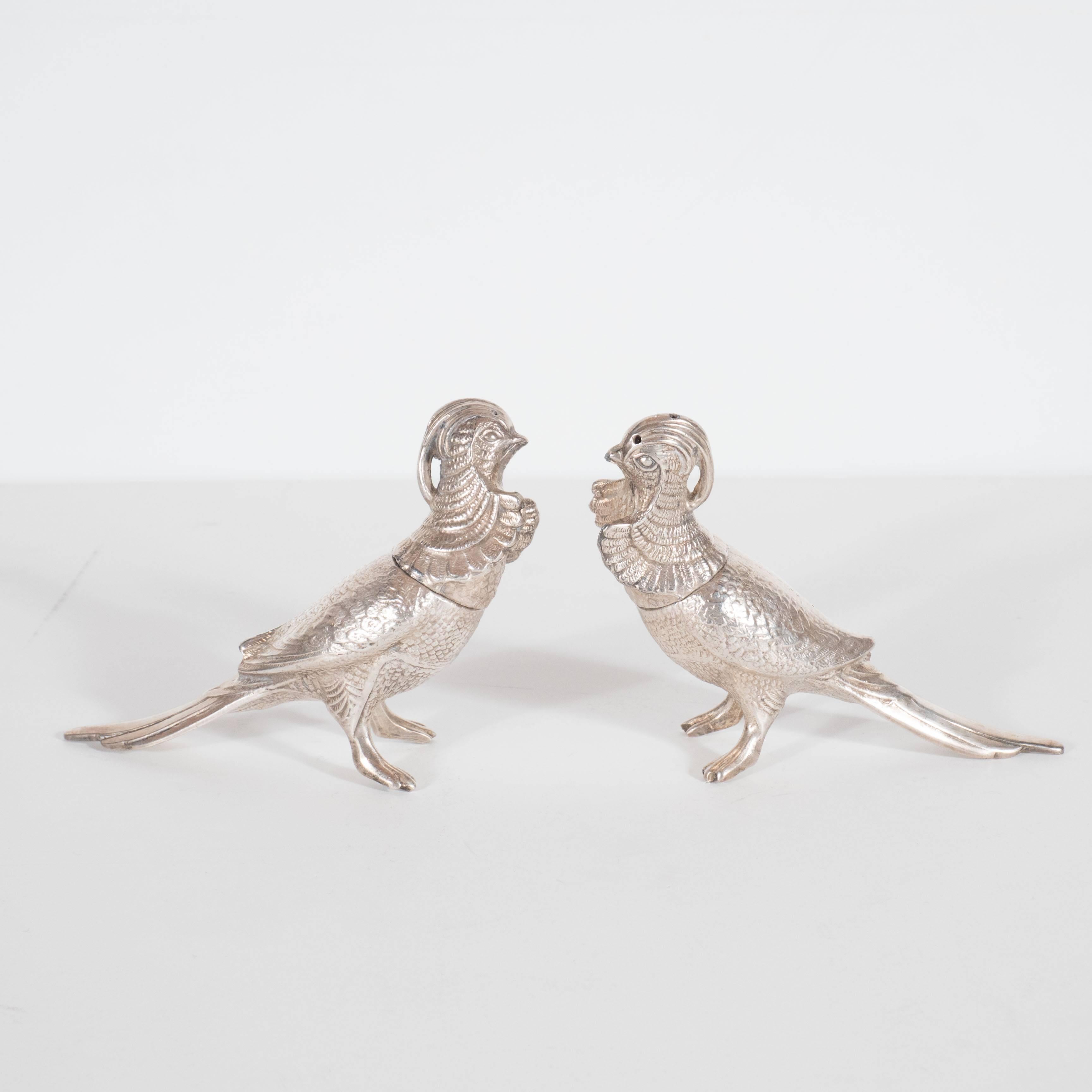 Charming pair of Art Deco salt /pepper shakers in the form of two freestanding exotic birds, both superbly engraved to be very realistic reproducing in great detail the plumage and features of exotic birds. Highly desirable and very decorative