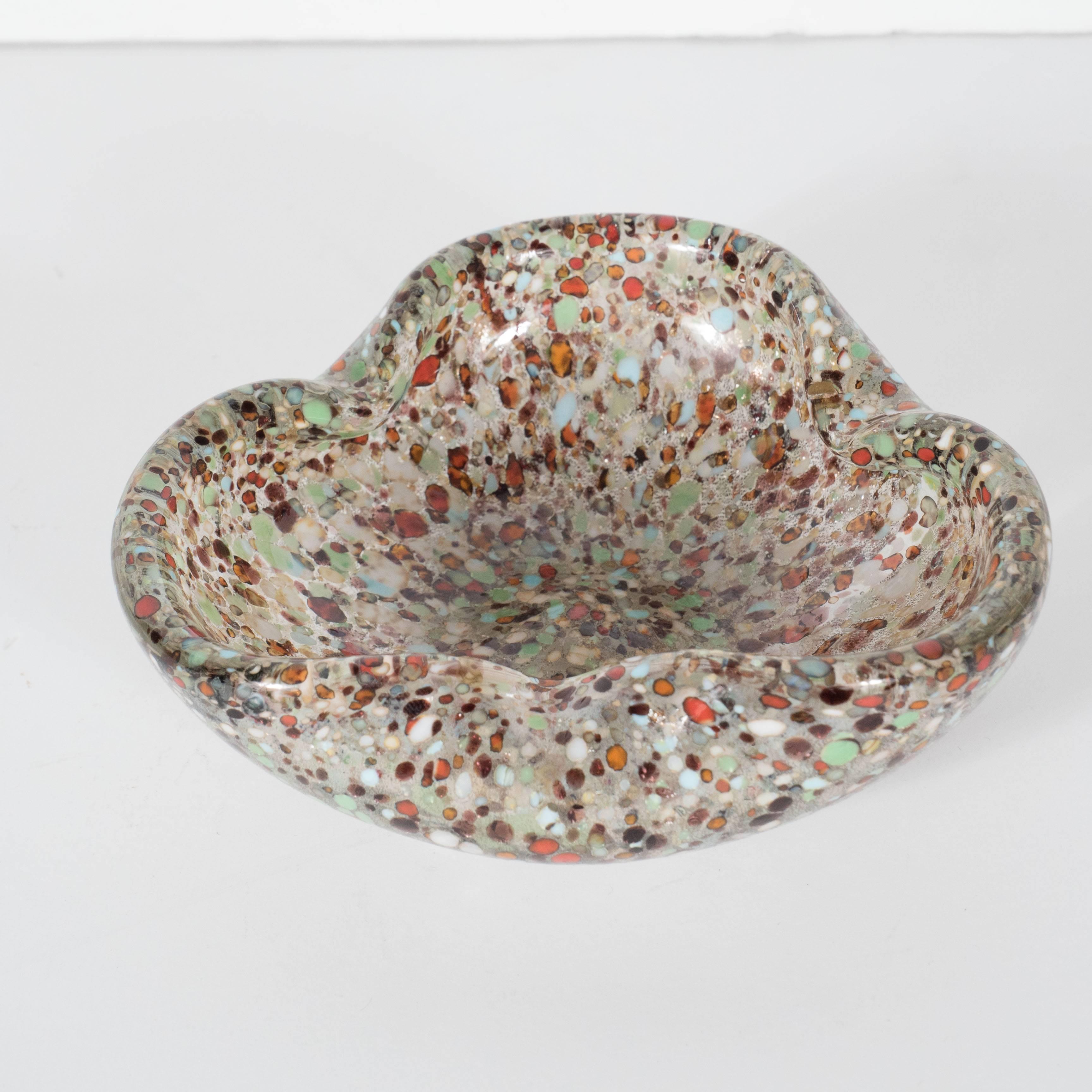 This handblown Murano glass bowl or ashtray features a folded two-fold design. It is made of speckled sea green, burnt orange, pearl, midnight blue all in smoked glass. A wonderful accent piece that will blend well with any decor. Excellent