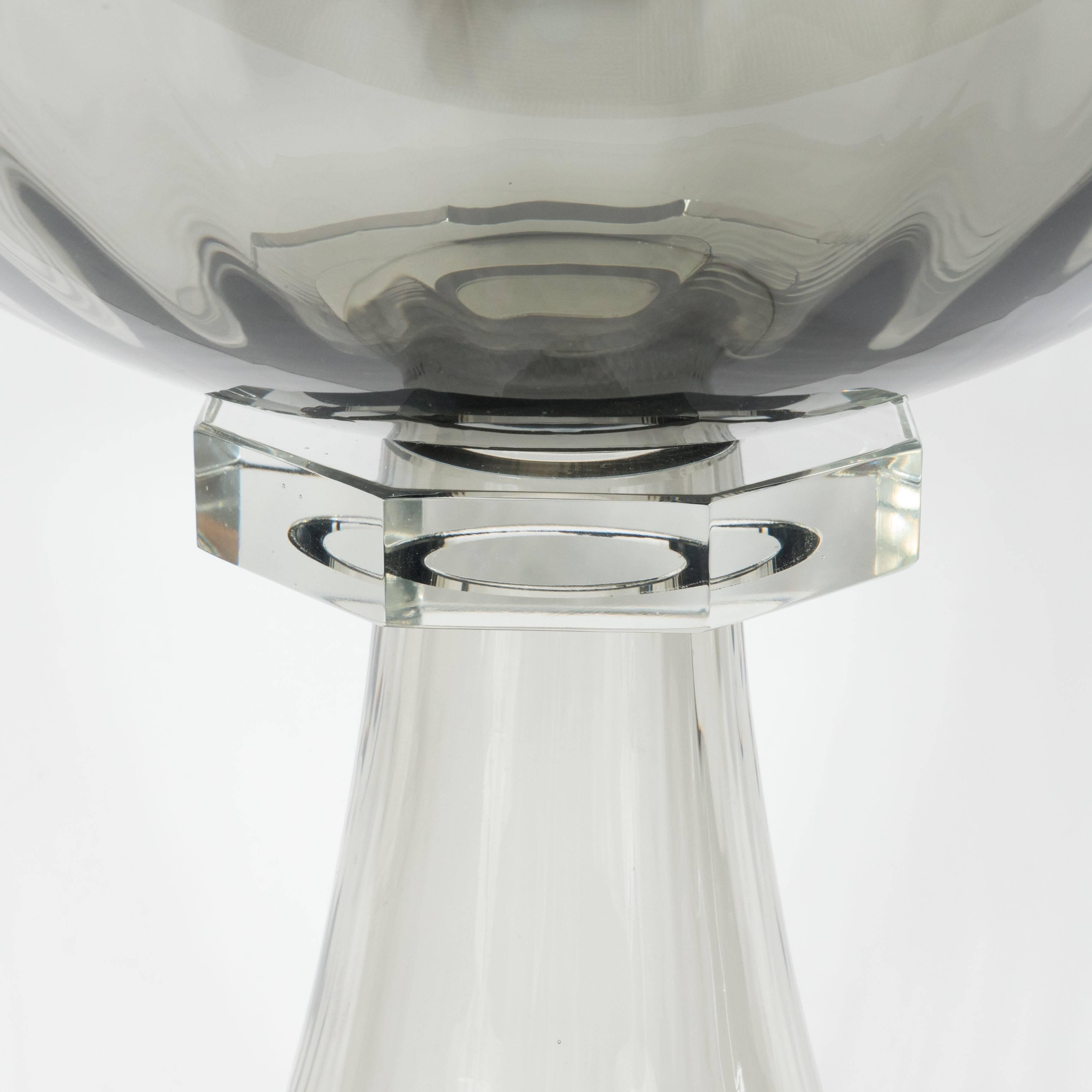 This handblown Murano glass bowl or vase features fluted footing with a tapered neck design in smoked glass. An elegant, clear octagonal glass collar supports a smoked glass bowl with fluted detail. Custom order, 6 week delivery.

Italian, 21st