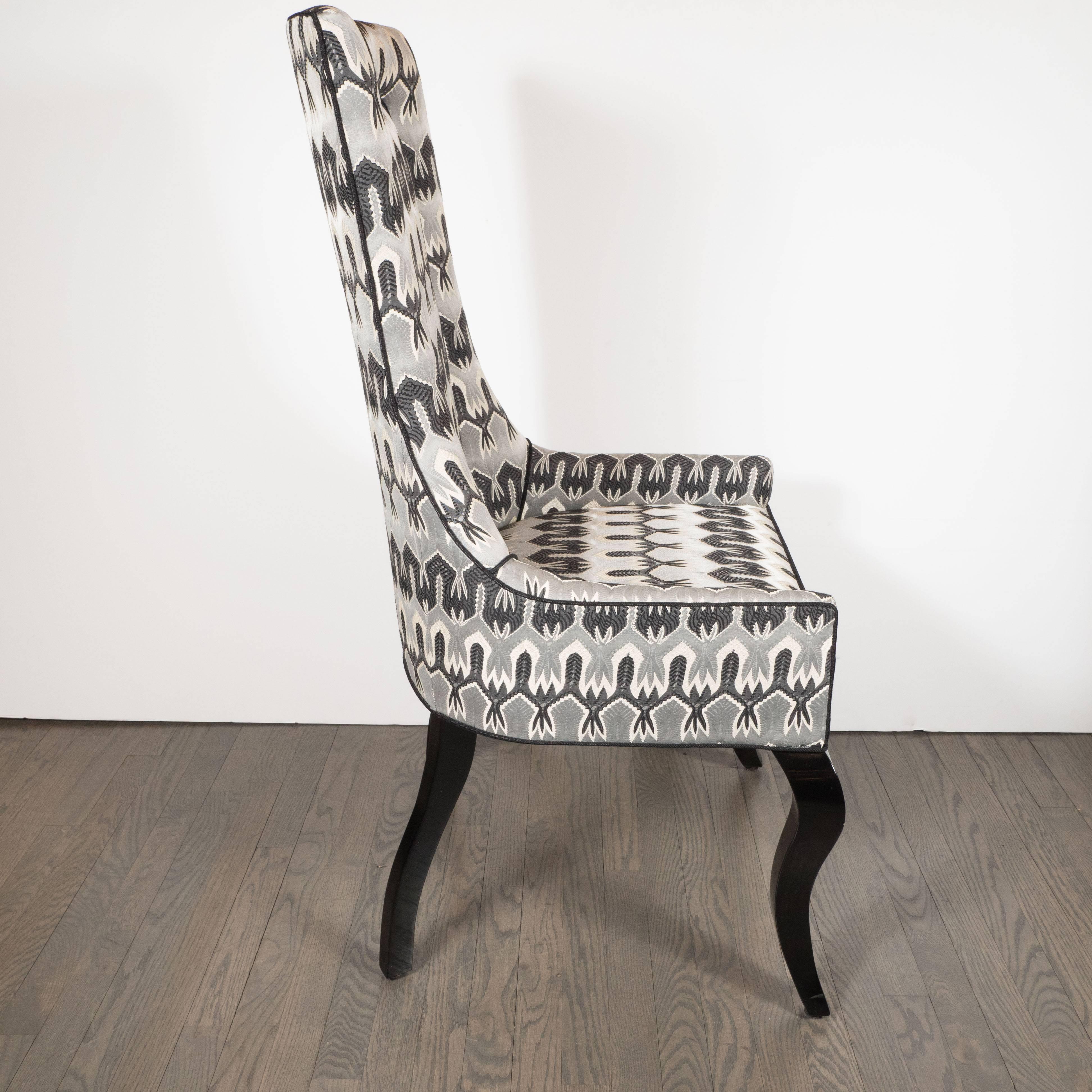 This elegant Mid-Century Modern high back/ desk chair has cabriole ebonized walnut legs, and a subtle hourglass shaped back. It is has been newly reupholstered in Missoni fabric in tones of platinum grey and black. Additionally, it has black piping