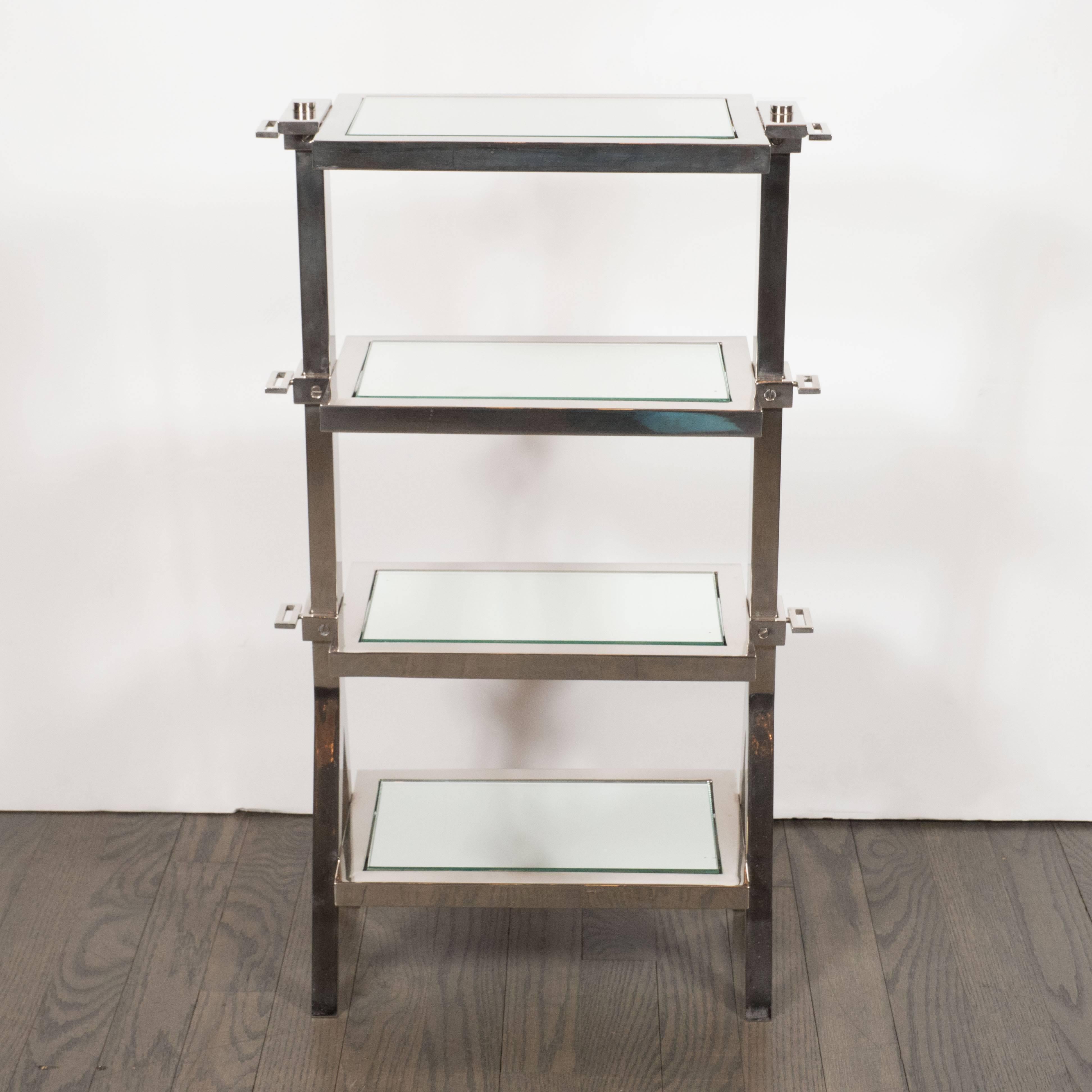 This very elegant nickel and mirror side table feature four tiers with inset beveled mirror panels with splayed leg design. This makes a wonderful drinks tables as well. A great example of the Machine Ages influence on Art Deco in America. Excellent