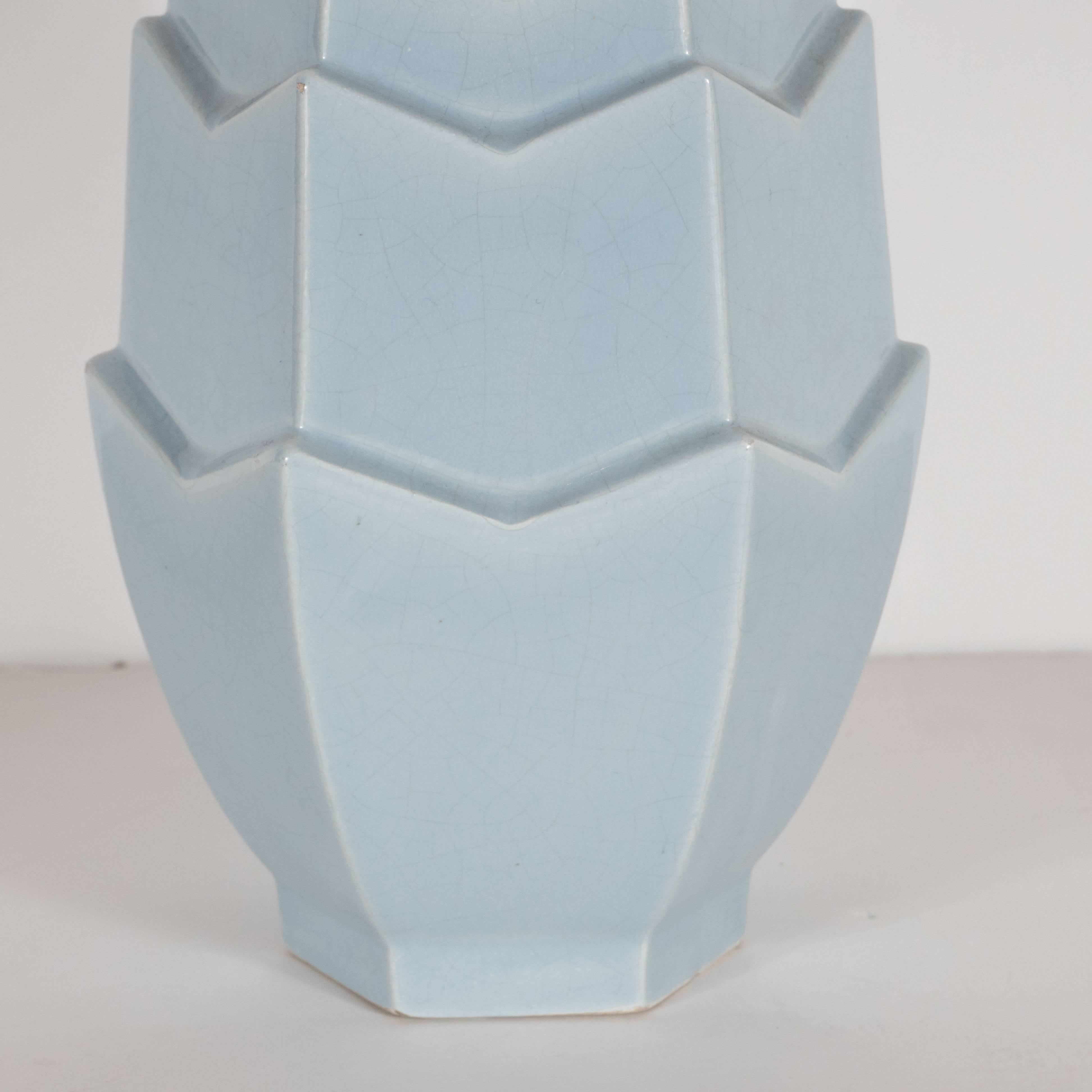 The renowned ceramic manufacturer Saint Clemente produced this Art Deco vase in the early 1930s. Executed in a beautiful grey powder blue with a craquelure glaze, the vase features a skyscraper polyhedral design consisting of five-tiers with notched