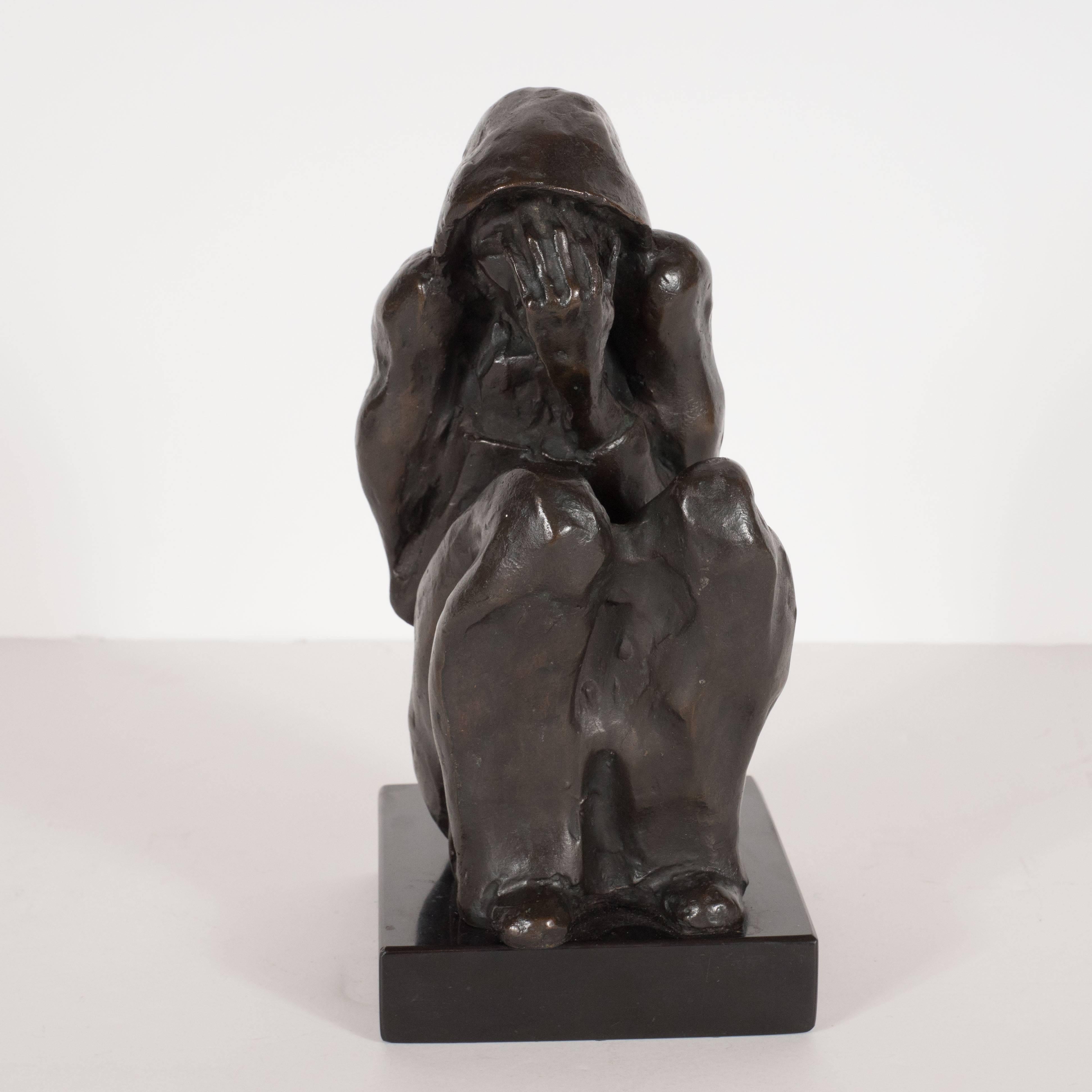 Mid-Century Modern bronze sculpture on black marble by listed artist Doris Caesar (1892-1971). This piece is called 