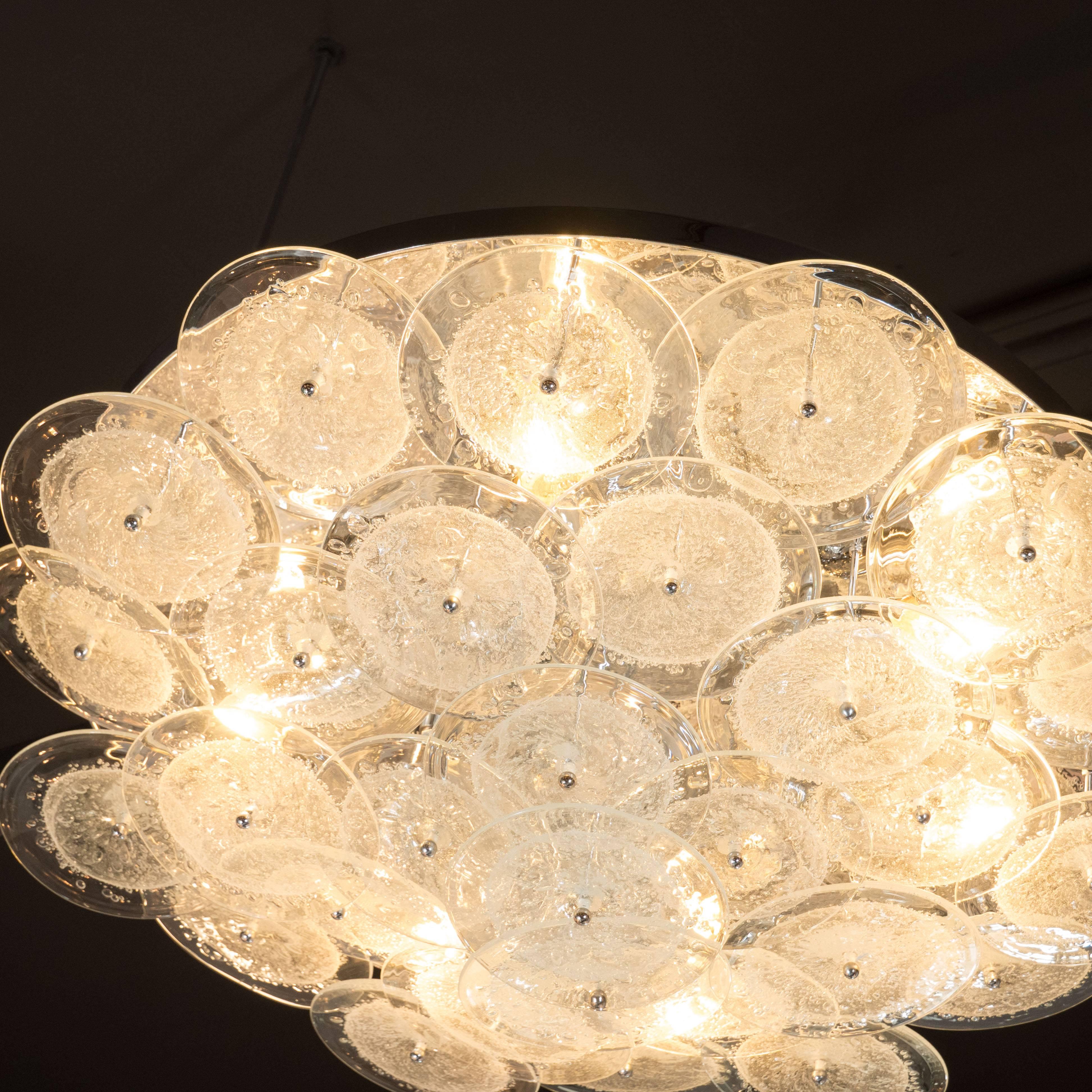 Flush mount chandelier with handblown Murano clear glass discs in the Manner of Vistosi. This flush mount chandelier consists of an array of numerous, individually attached handblown Murano clear glass discs that each incorporate a central bubbled