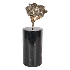 Pyrite Specimen in a Sculptural Bronze Cradle Attached to a Black Marble Base