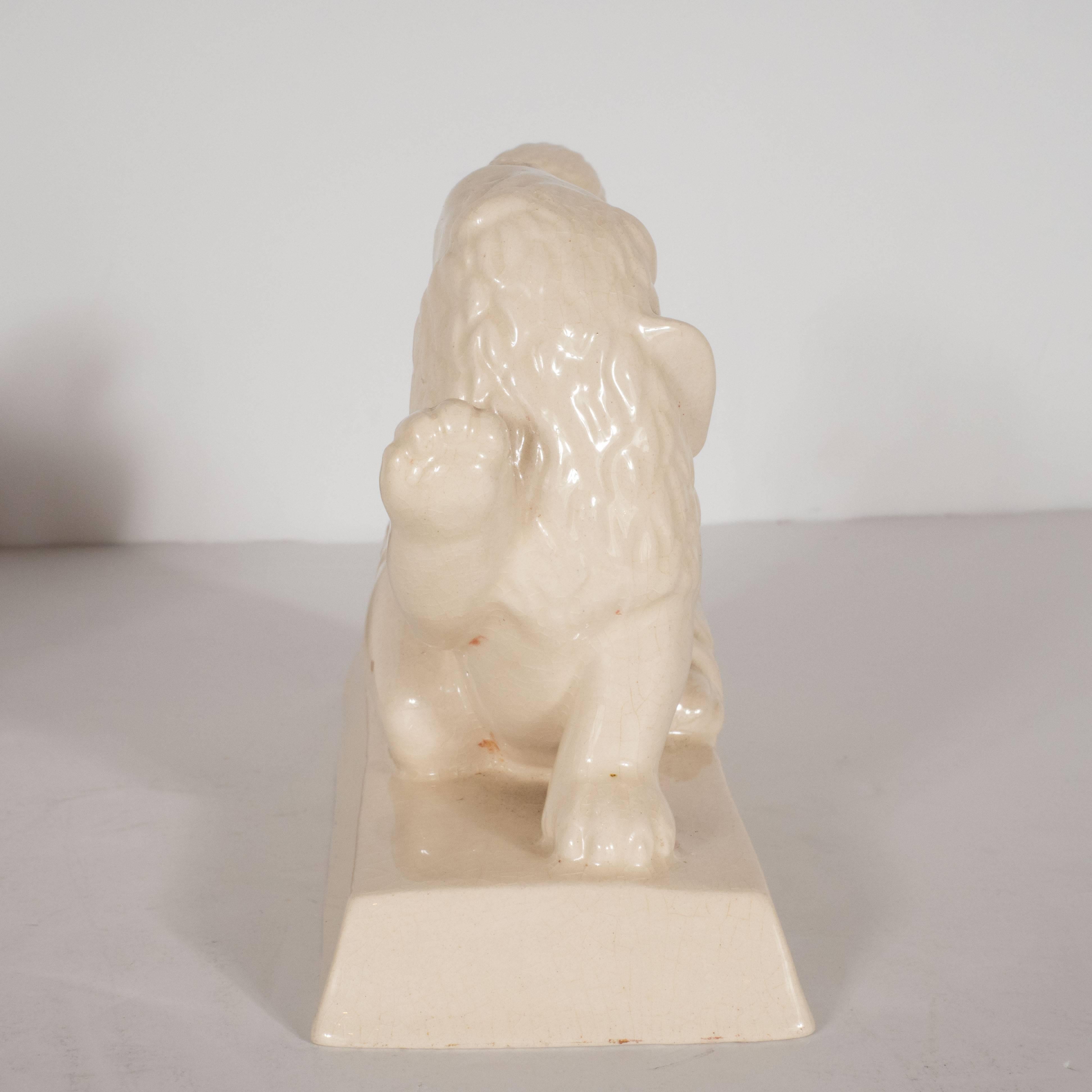 Mid-20th Century Art Deco Ceramic Book Ends Featuring Lion and Nude Female Figure For Sale
