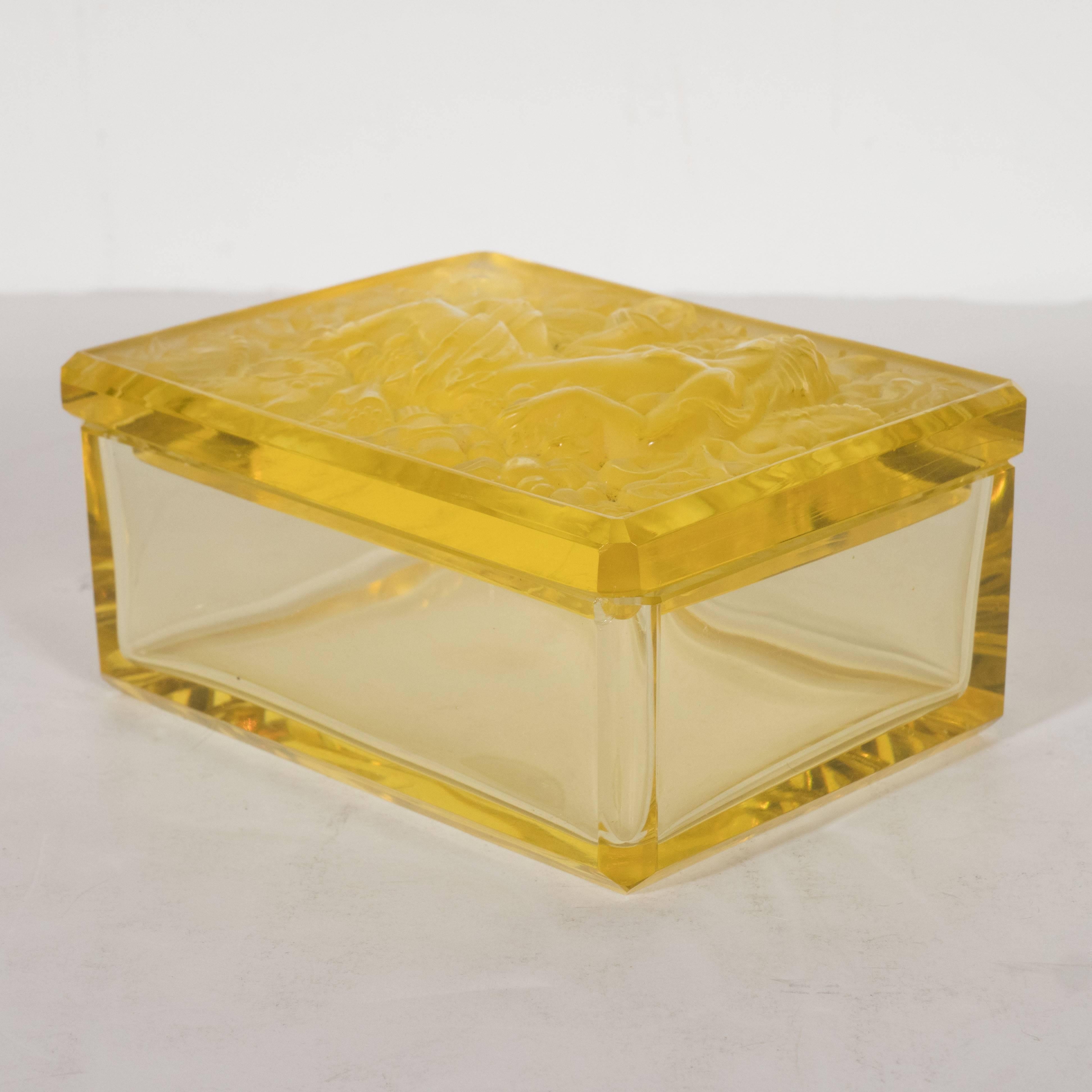 This stunning French Art Deco citrine box features translucent sides, beveled corners and a lid adorned with an exuberance of raised designs in frosted glass. In the center, there is a greek goddess in repose. A toga is draped over her lower