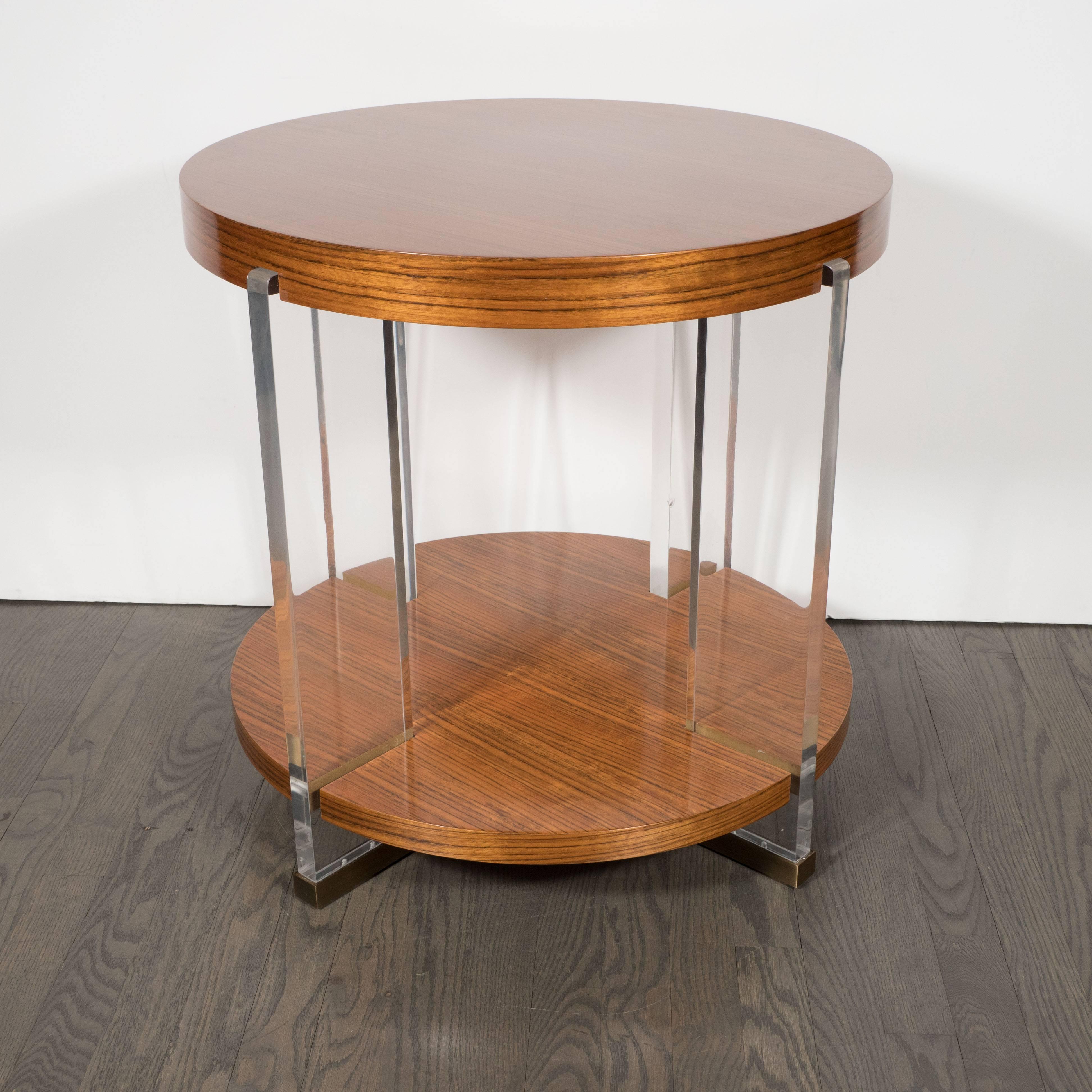 American Vanguard Circular Table in Bookmatched Mozambique with Lucite Supports