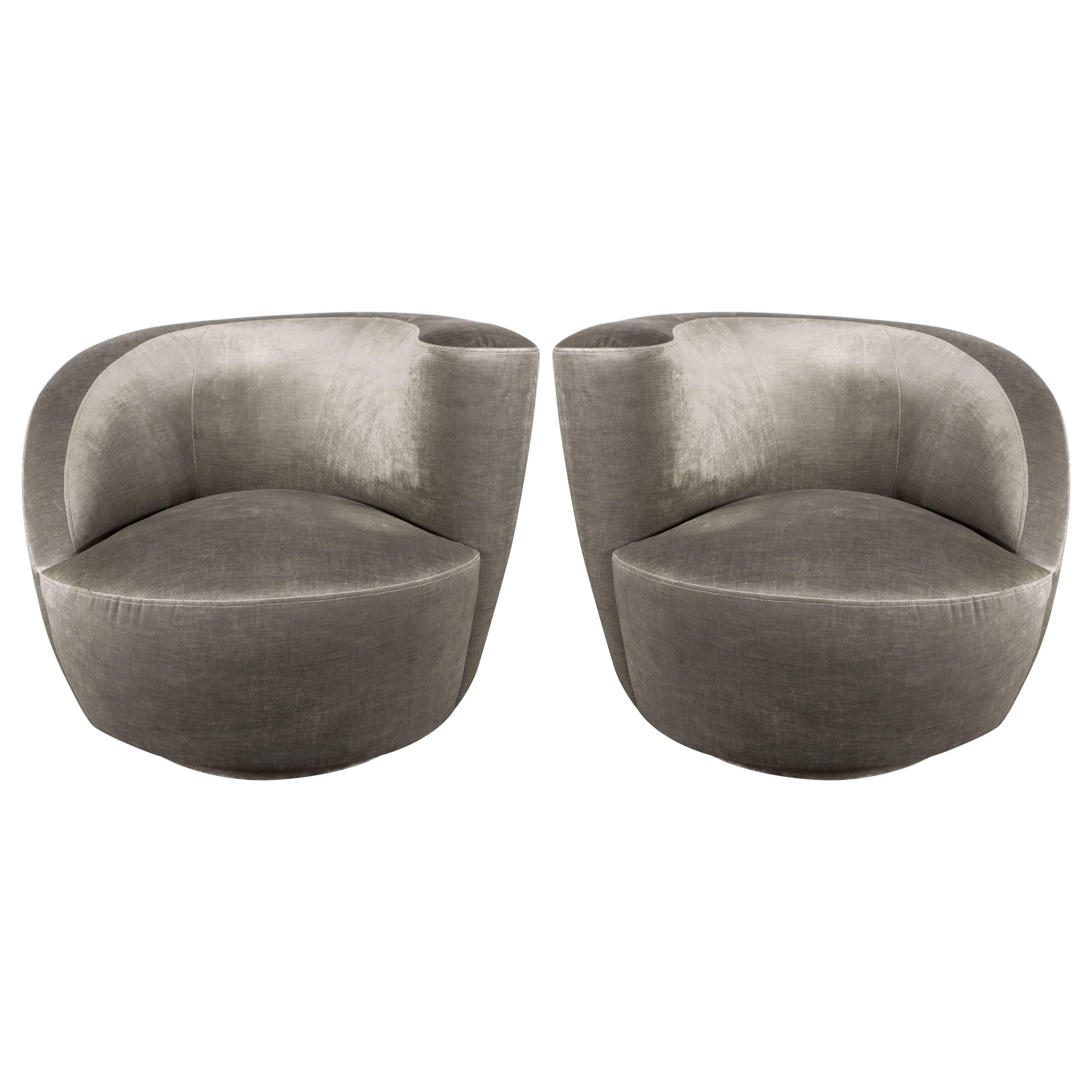 This pair of Nautilus chairs exemplify the stunning organic futurist forms and clean lines for which Vladimir Kagan one of the most esteemed furniture designers of the 20th century is celebrated. The chairs' form suggests an abstracted