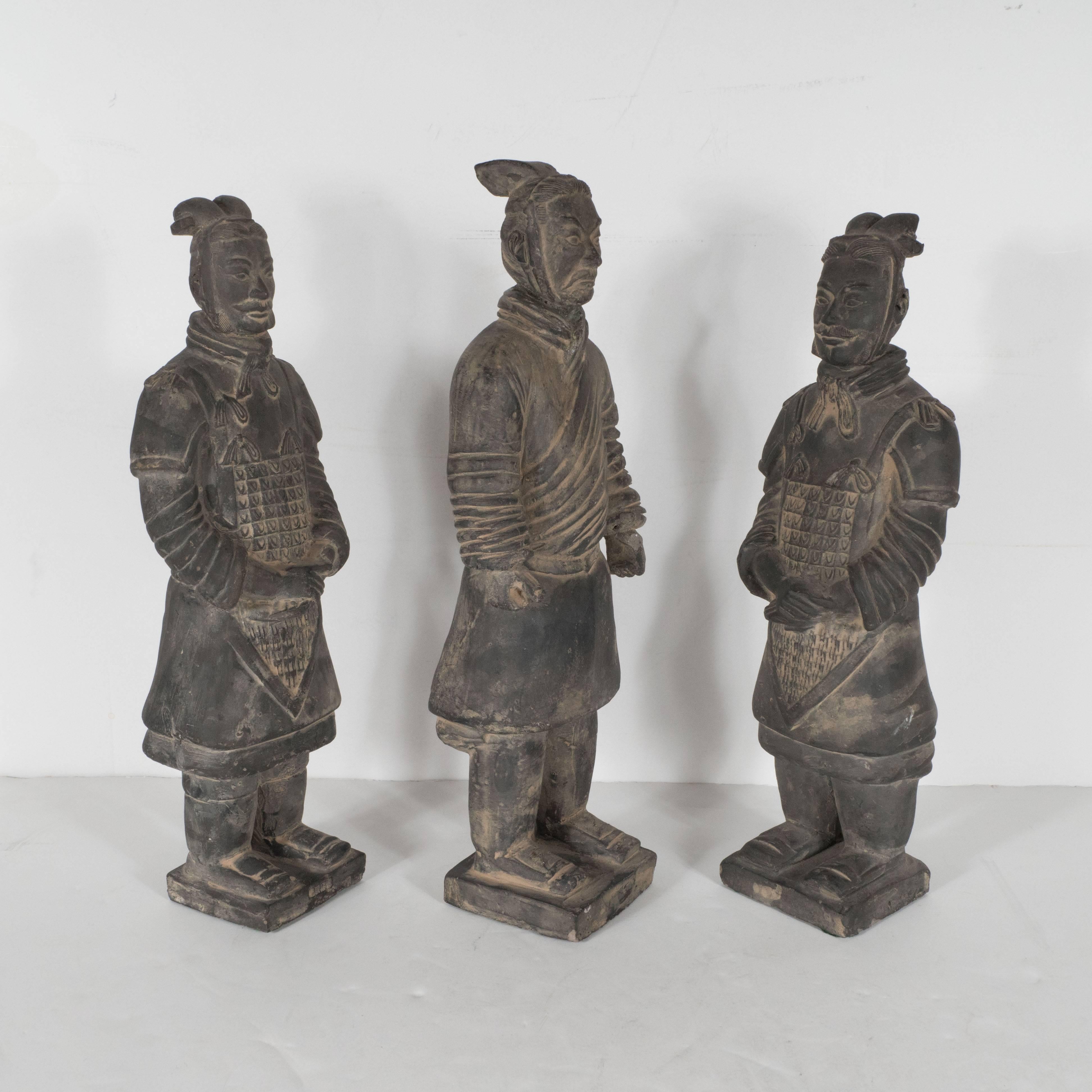 This set of three terracotta burial soldiers represent impeccable replicas of the original figurines from Qin Shi Huang's (the first Emperor of China) from roughly 200 B.C. Discovered in 1974 by farmers in Lintong District, Xi'an, Shaanxi province,
