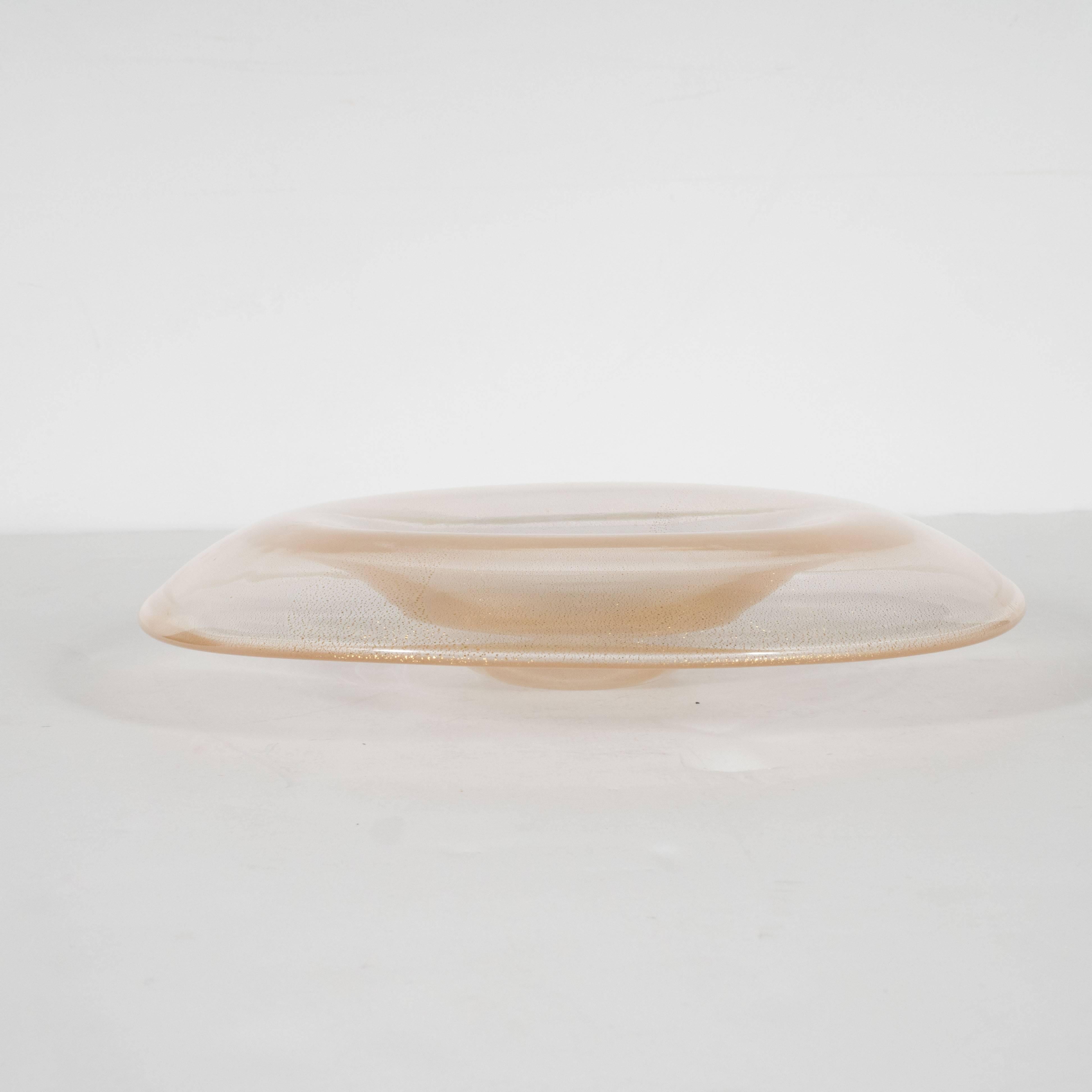 This stunning handblown Murano glass bowl features a constellation of 24-karat gold flecks, like an abundance of gold dust in a crystalline stream. This piece was designed by the illustrious Elsa Peretti- recipient of the Coty Award- and long-time