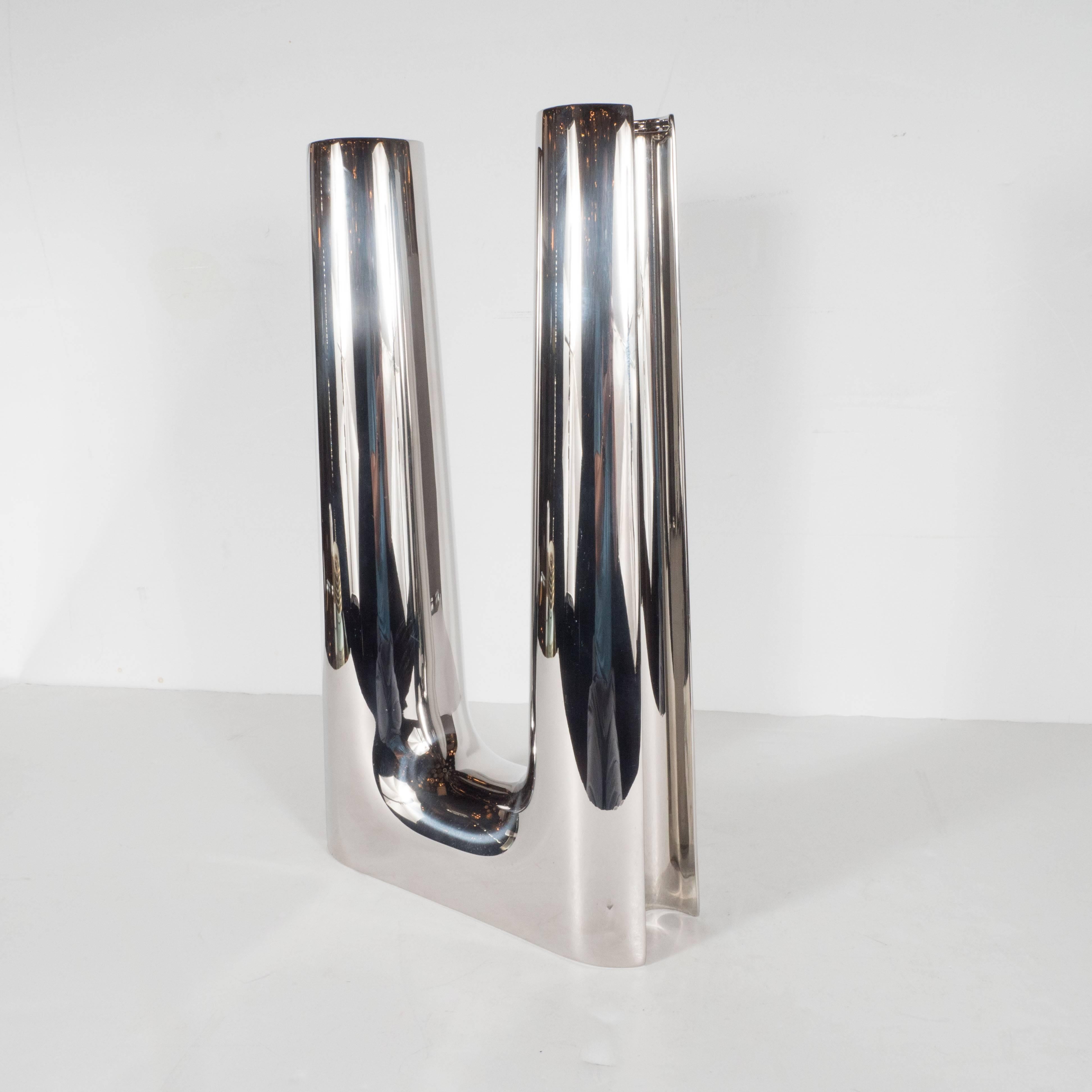 This stunning candleholder is part of the legendary Danish design firm, George Jensen's Copenhagan collection. Søren Georg Jensen originally created this model (1085, Large) to decorate the alter of a Mid-Century Scandinavian church in the 1960s.