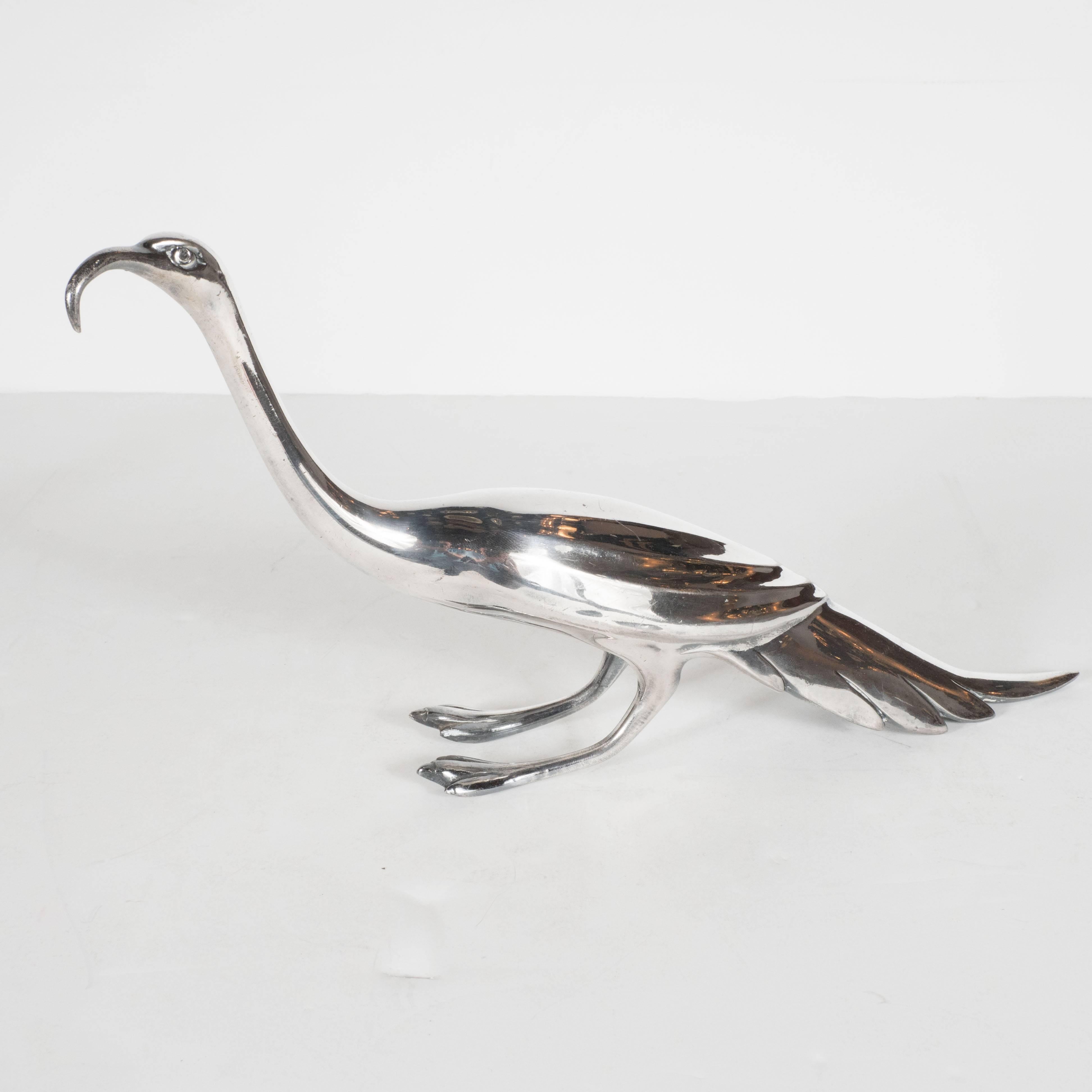 This pair of silver plated peacocks- one male, one female- was produced by the renowned American maker Weidlich Brothers Manufacturing Company, circa 1930. They are simultaneously whimsical, elegant, and sophisticated- representing perfect objet