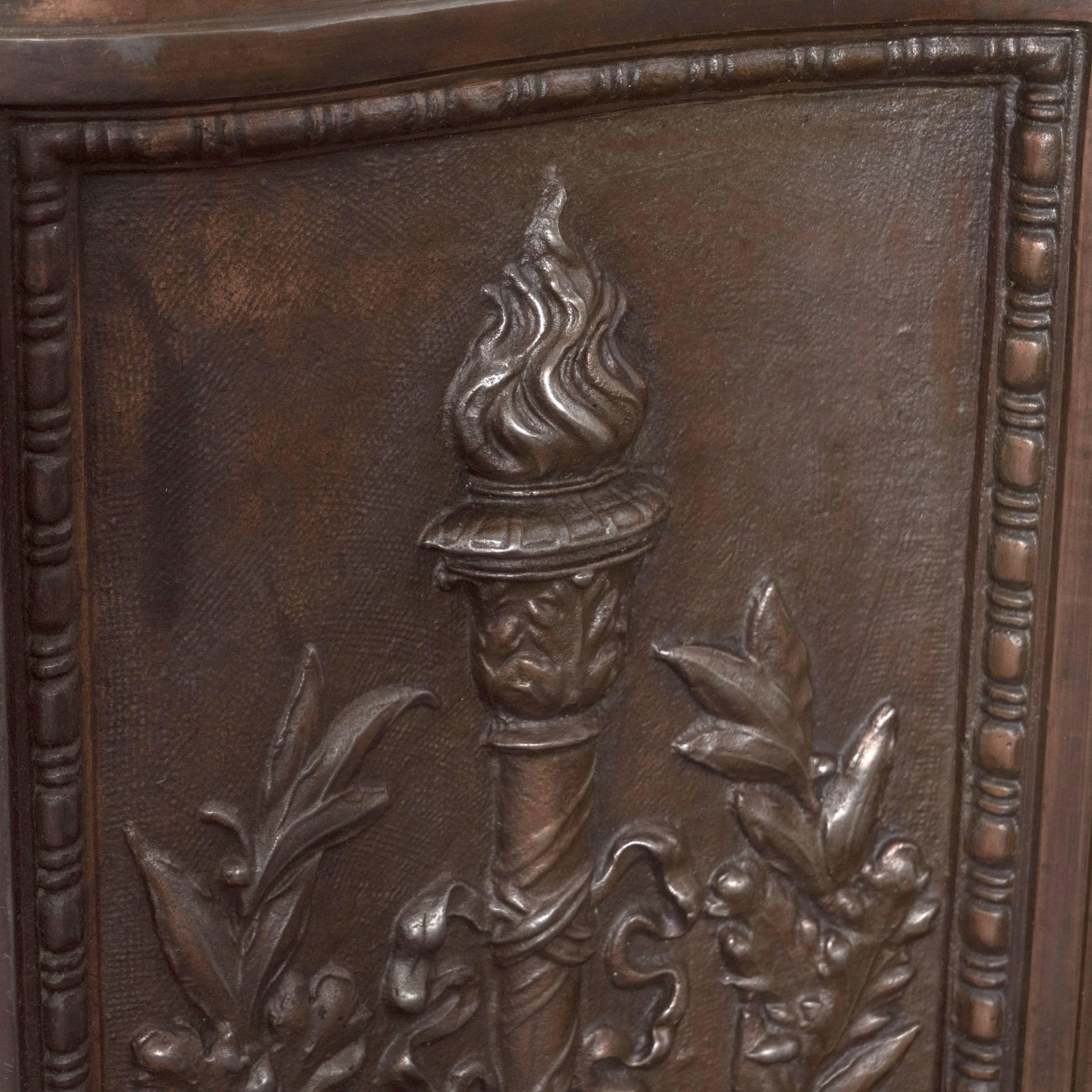 Neoclassical Revival American Bronze-Plated Iron Fireback with Crest, Torch and Foliate Motifs For Sale