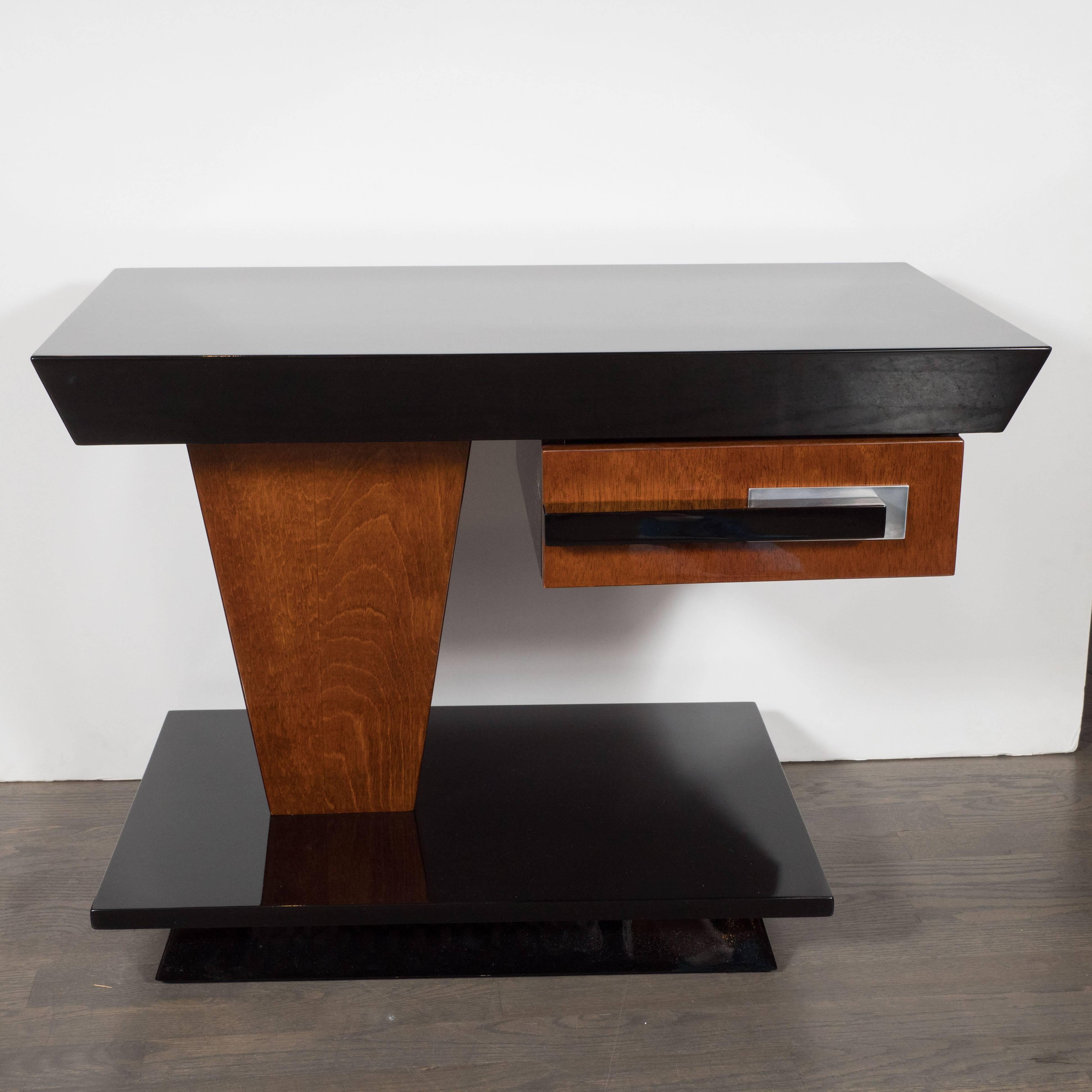 This stunning pair of Machine Age Art Deco end tables were designed in the manner of the legendary Donald Deskey, the legendary visionary behind Radio City Music Hall, circa 1935. They were realized from the finest materials available including